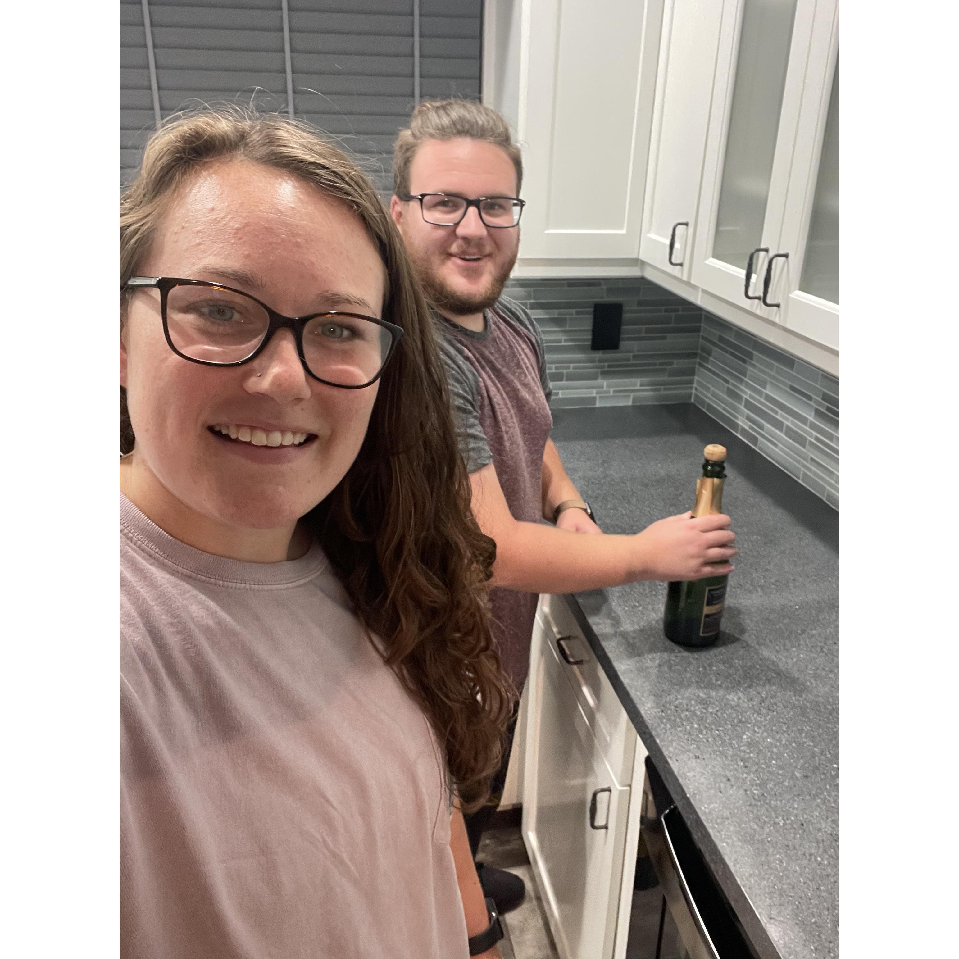 Opening up the champagne in the our new house!