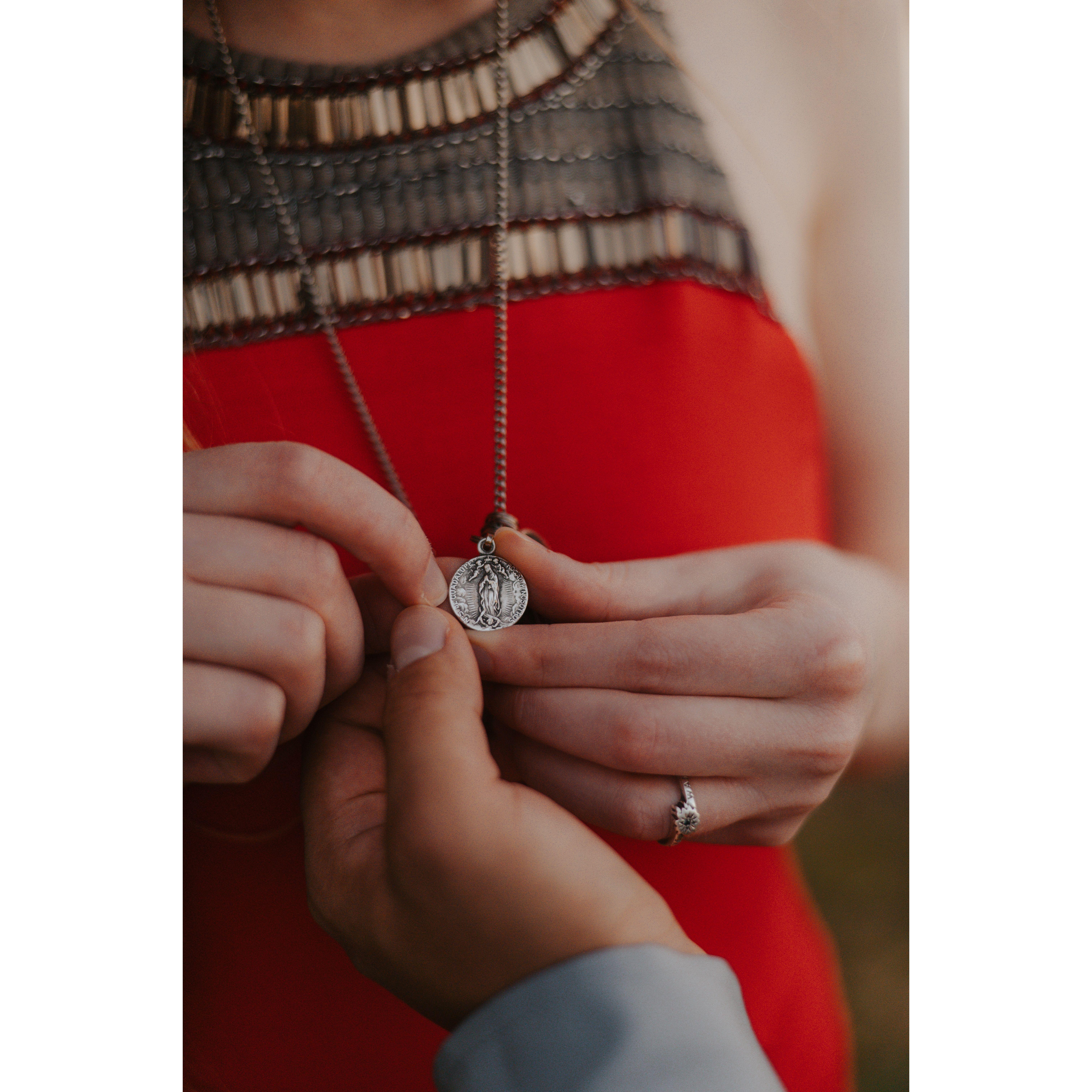 A medal of Our Lady of Guadalupe that Vic gave to Emily. Photo Credit: Lindsey Angus of HeartSpeaksVisuals, our Engagement and Wedding Photographer.