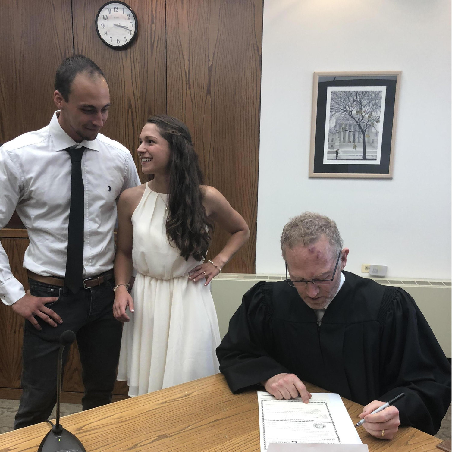 Signing our marriage certificate in Denver, CO, USA (June 2018)