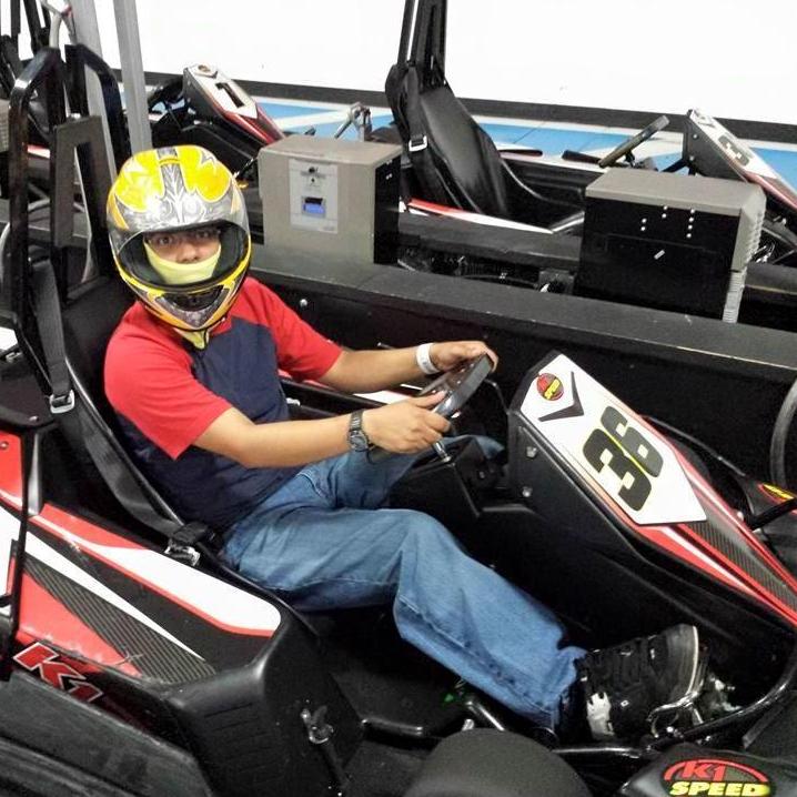 Him about to ride in a Go Kart in San Antonio for her 21st birthday.