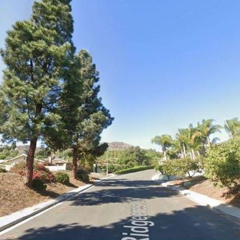 Please park along Ridgecrest Dr. The entrance will be to the left behind the residence.