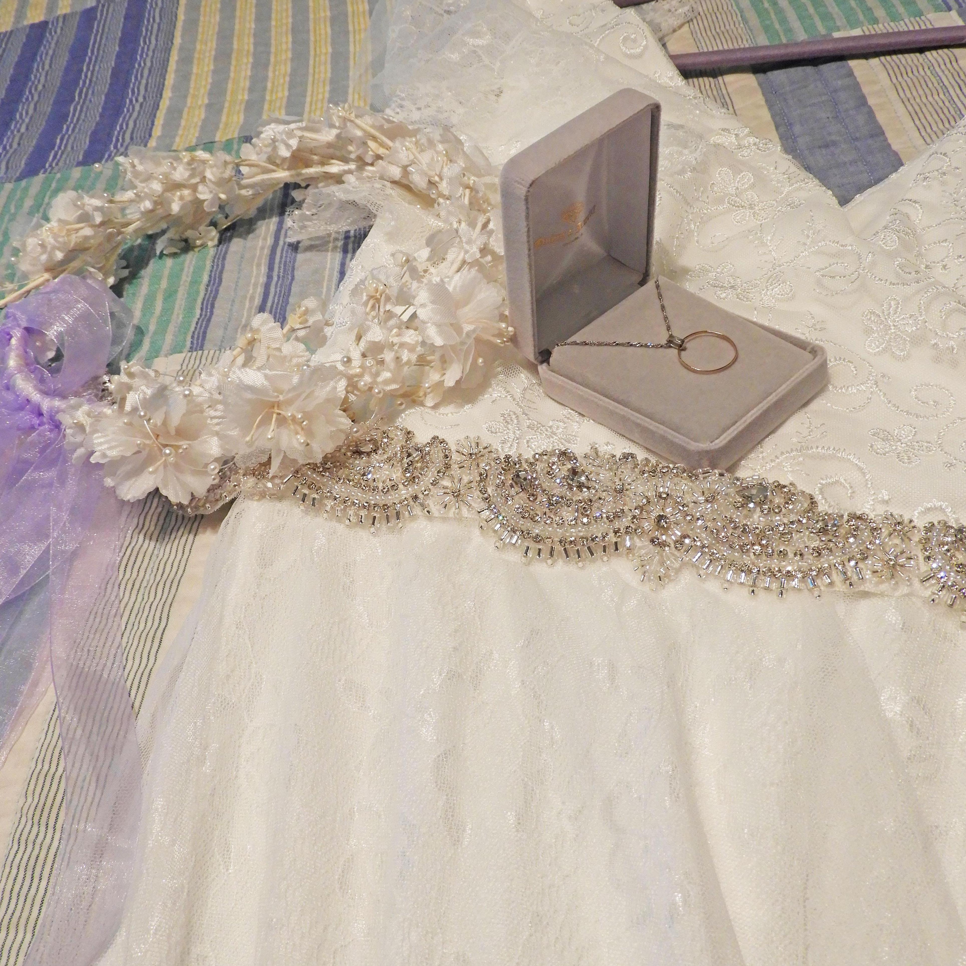 Borrowed: headpiece from Megan's mom's wedding, beaded belt from Megan's custom wedding dress

Old: Megan's grandmother's wedding ring fashioned into a necklace

New: Megan's COVID-19 wedding dress