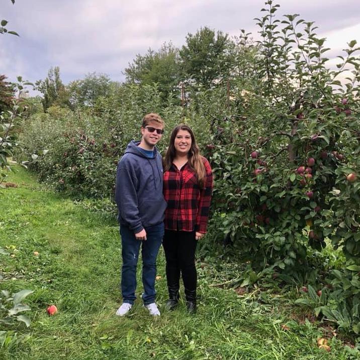 Our first time at an apple orchard together: we're the apple of each other's eyes
