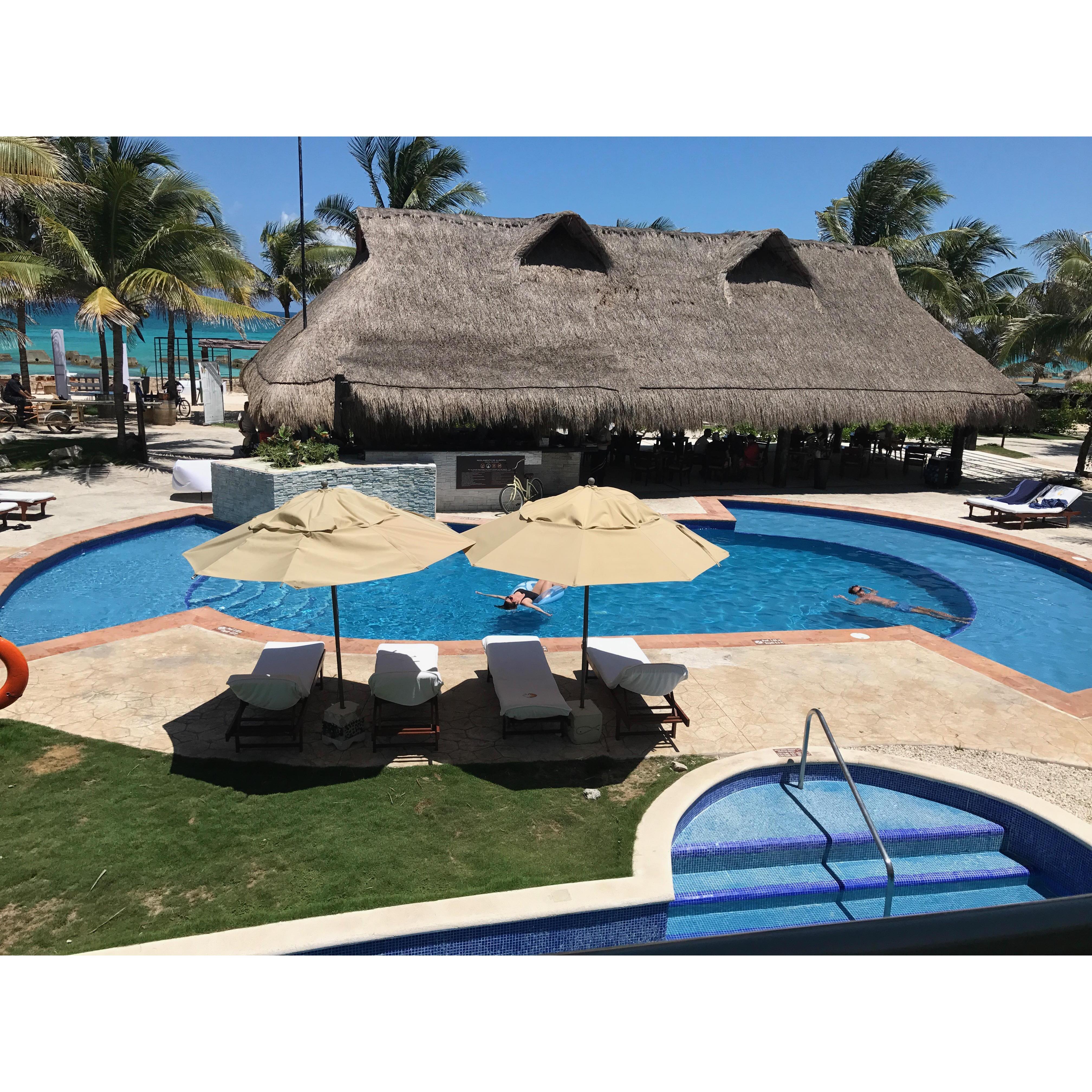 Building 2 - view from 2nd floor room of Davis floating in our semi-private pool! The stairs at the bottom are coming up from a swim out suite.