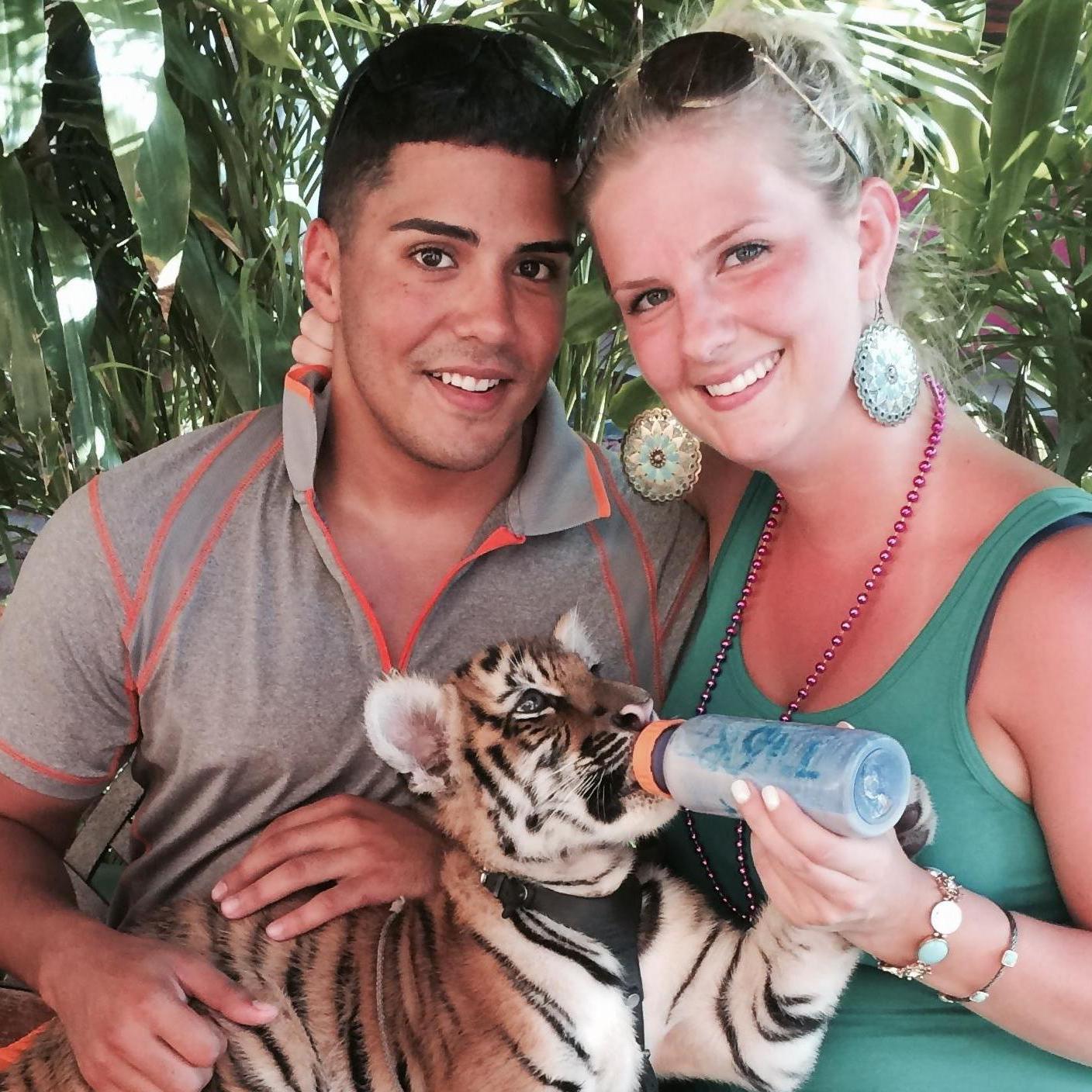 Feeding a baby tiger in Mexico, 2014.