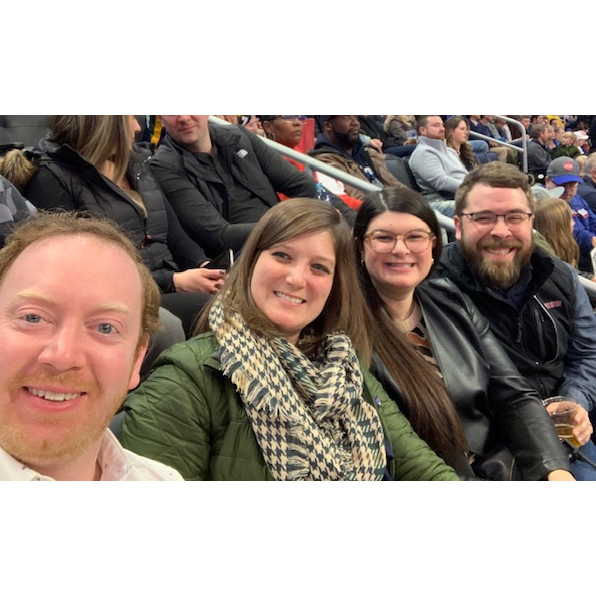 Brendan, Lindsey, Mary, and Jeff at a Pistons Game at Little Caesars Arena.
