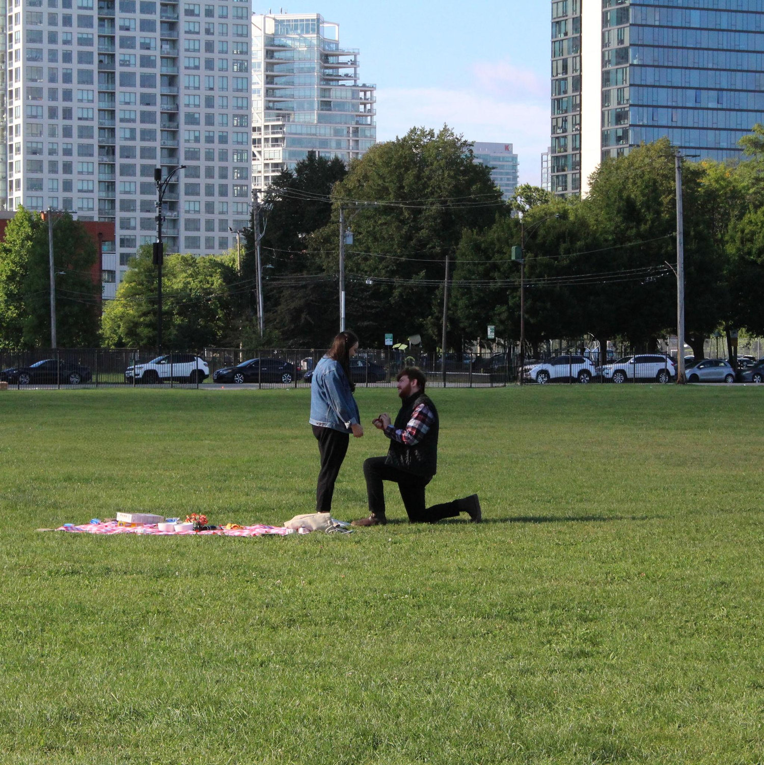 The proposal!!! Nathan recreated our cereal picnic date from a year earlier at the same exact place and with the same exact picnic blanket :) -- September 5, 2025