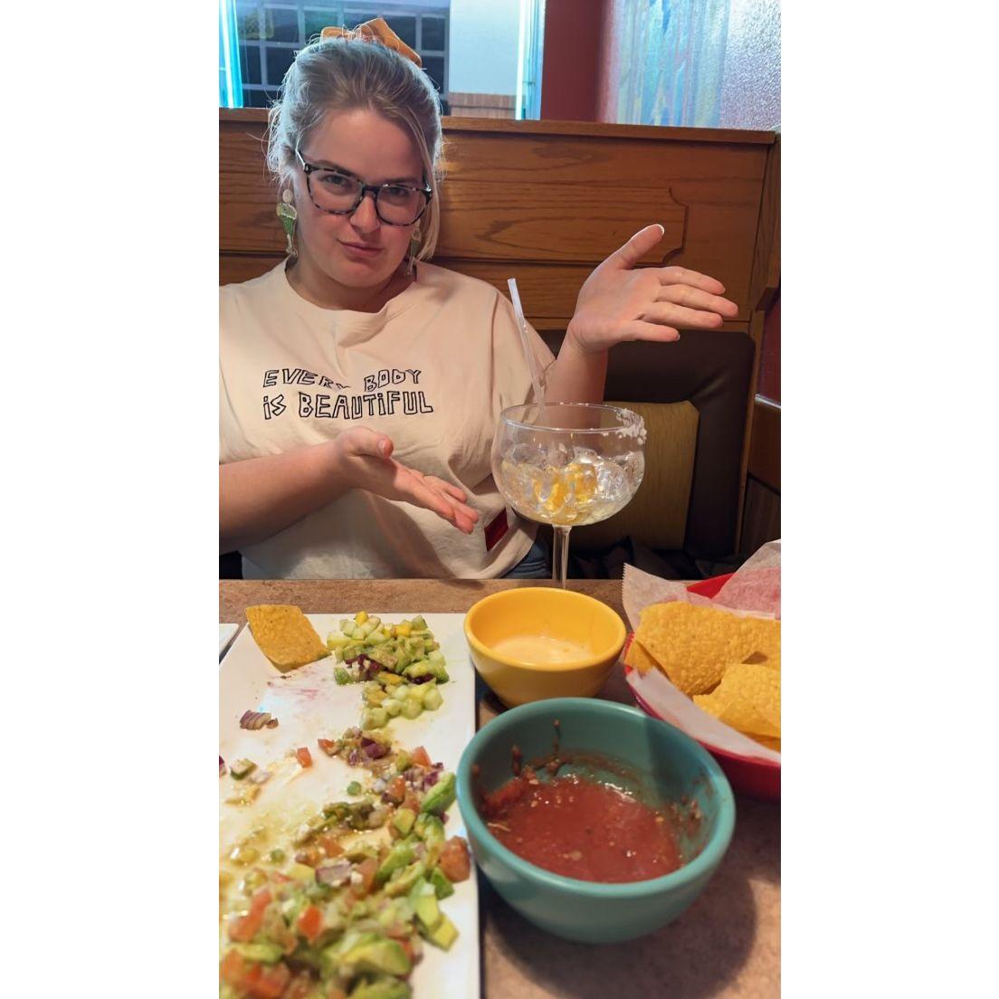 Margarita Magic... Here, Kelsey proudly displays how she has made her margarita disappear. This is still Rahum's lock screen.