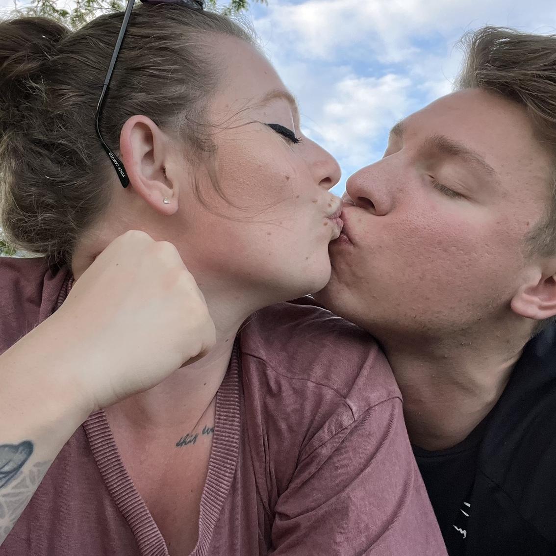 Celebratory smooch for signing the lease on our first place, which happened to be a block away from where we had our first date