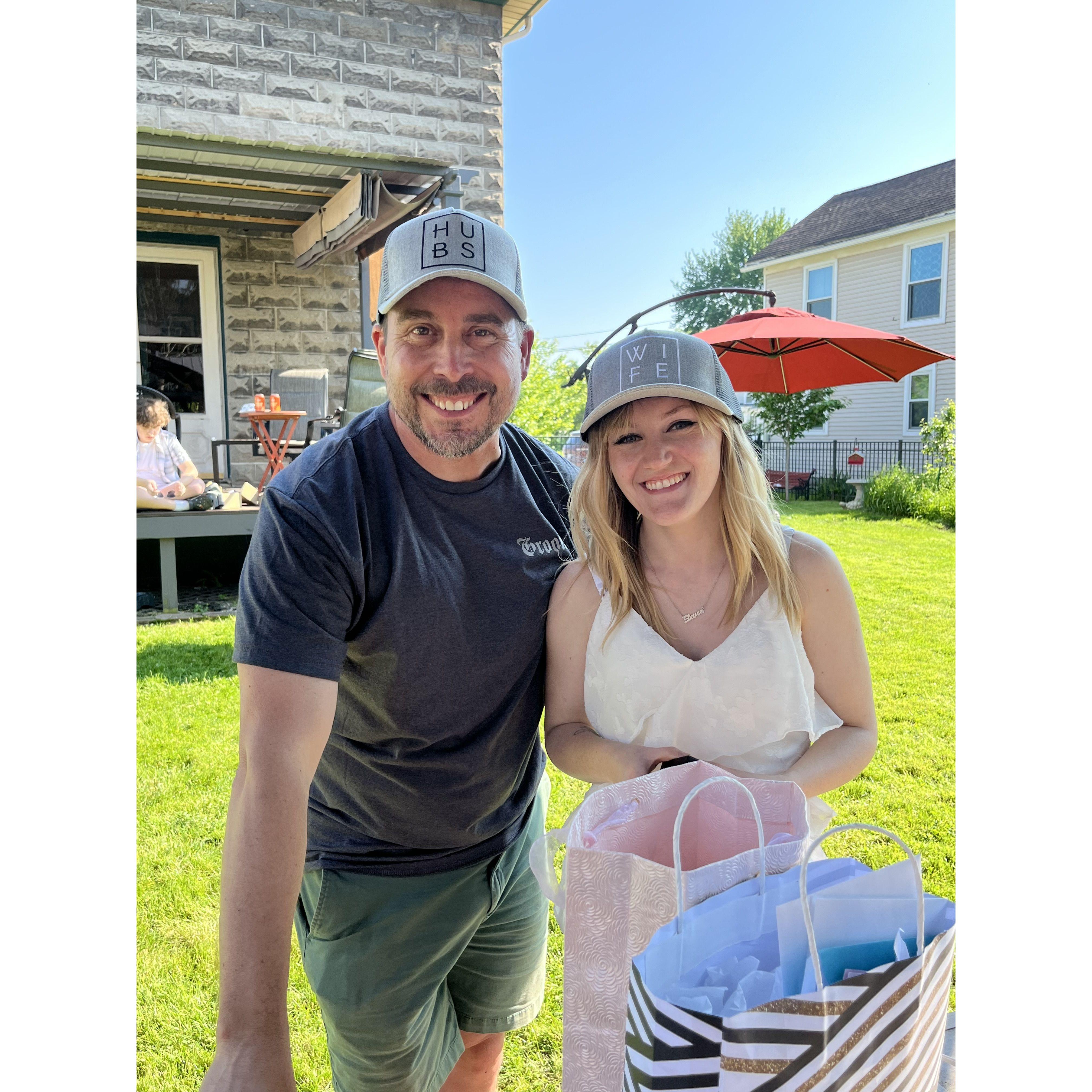 Mom took a picture of us at our engagement party wearing a gift of hats Lindsey gave us
