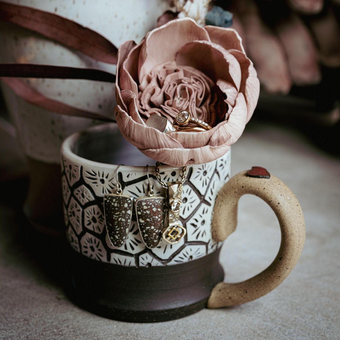 Custom Petoskey mug made by Stassia & Chris. Earrings by local artist James Blanchard (made of copper fire brick form the UP).