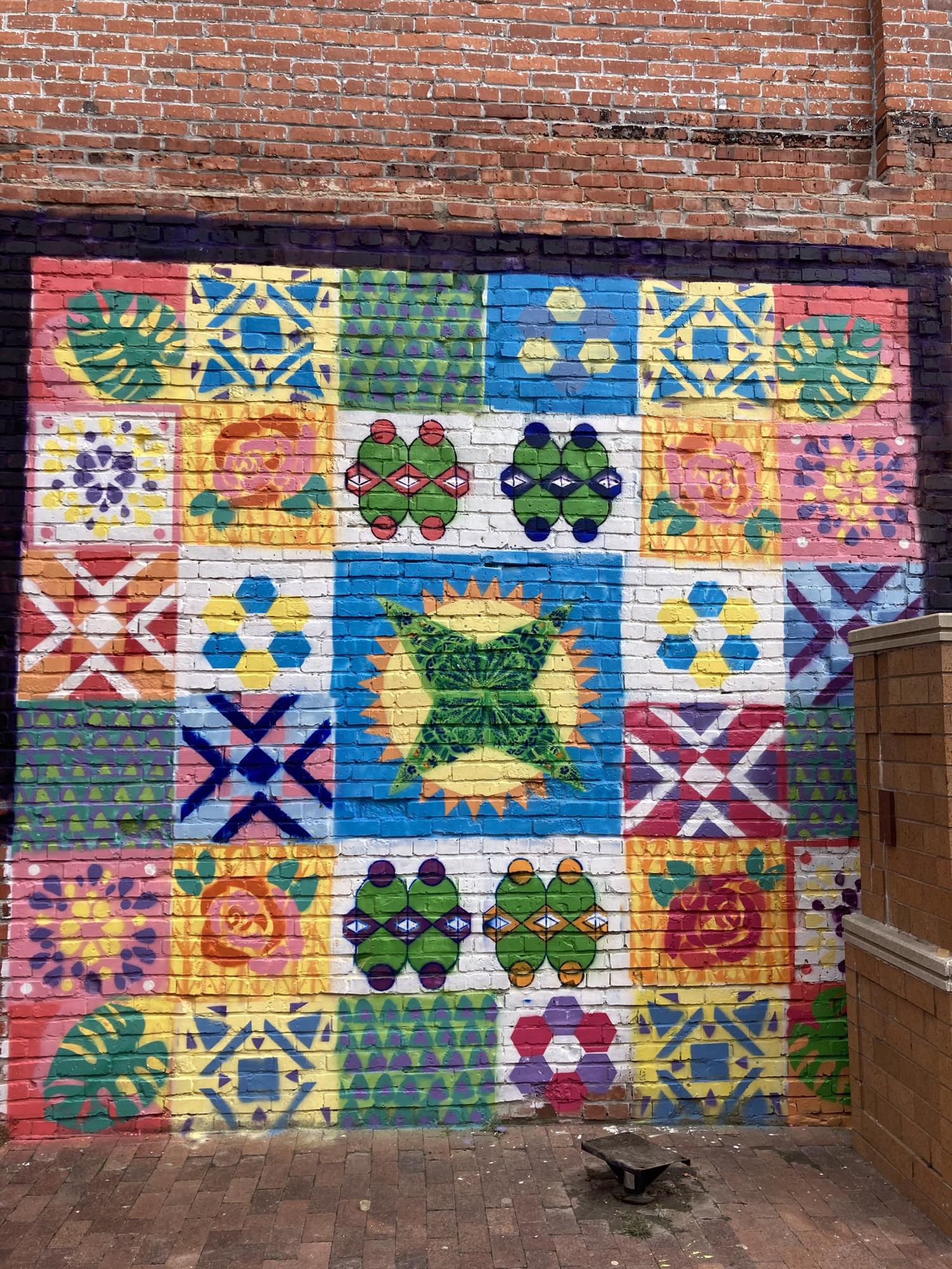 A better photo of the mural. Any guesses which four pattern blocks were ours?