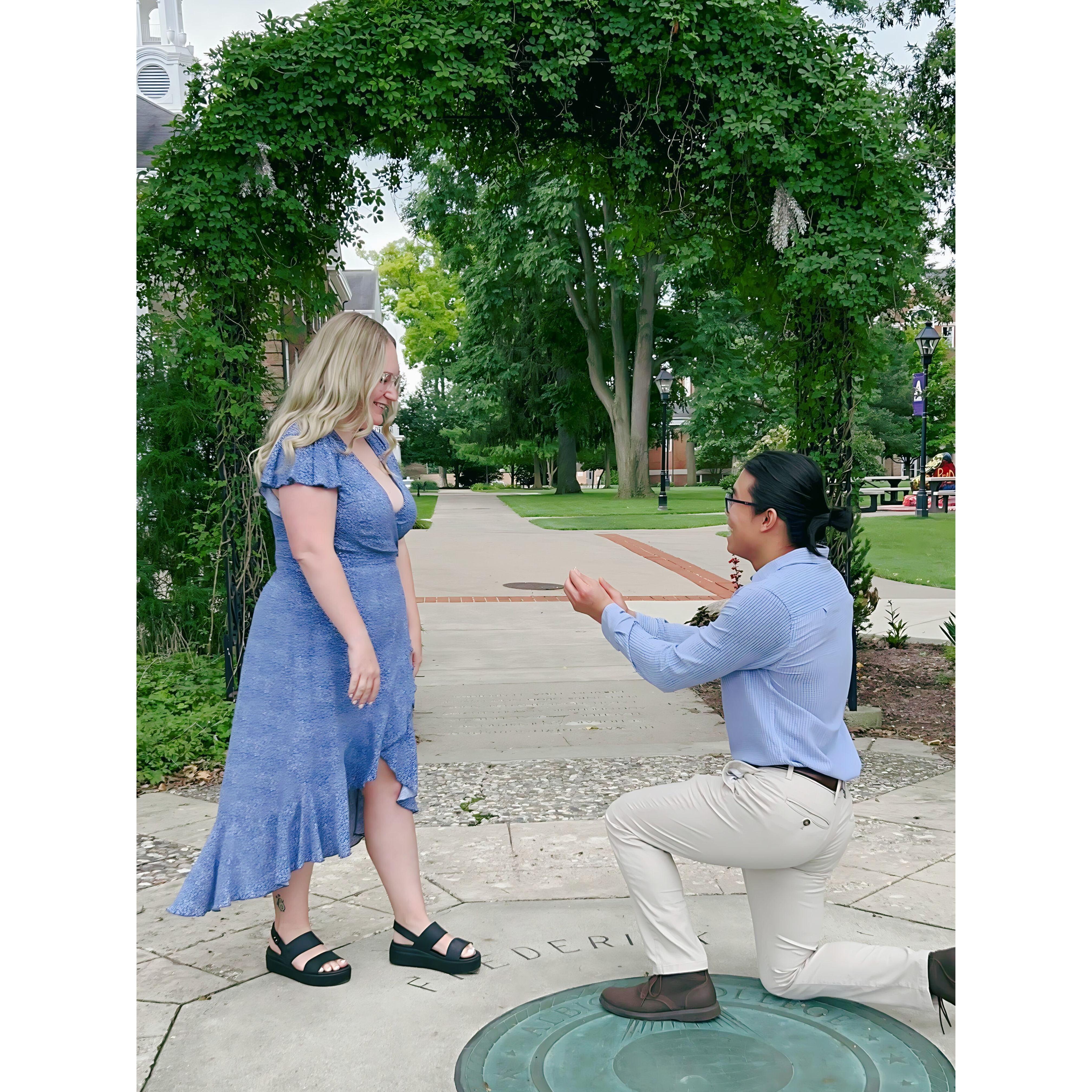 Matt's proposal in the grotto behind Vulgamore Hall, where we met in class.