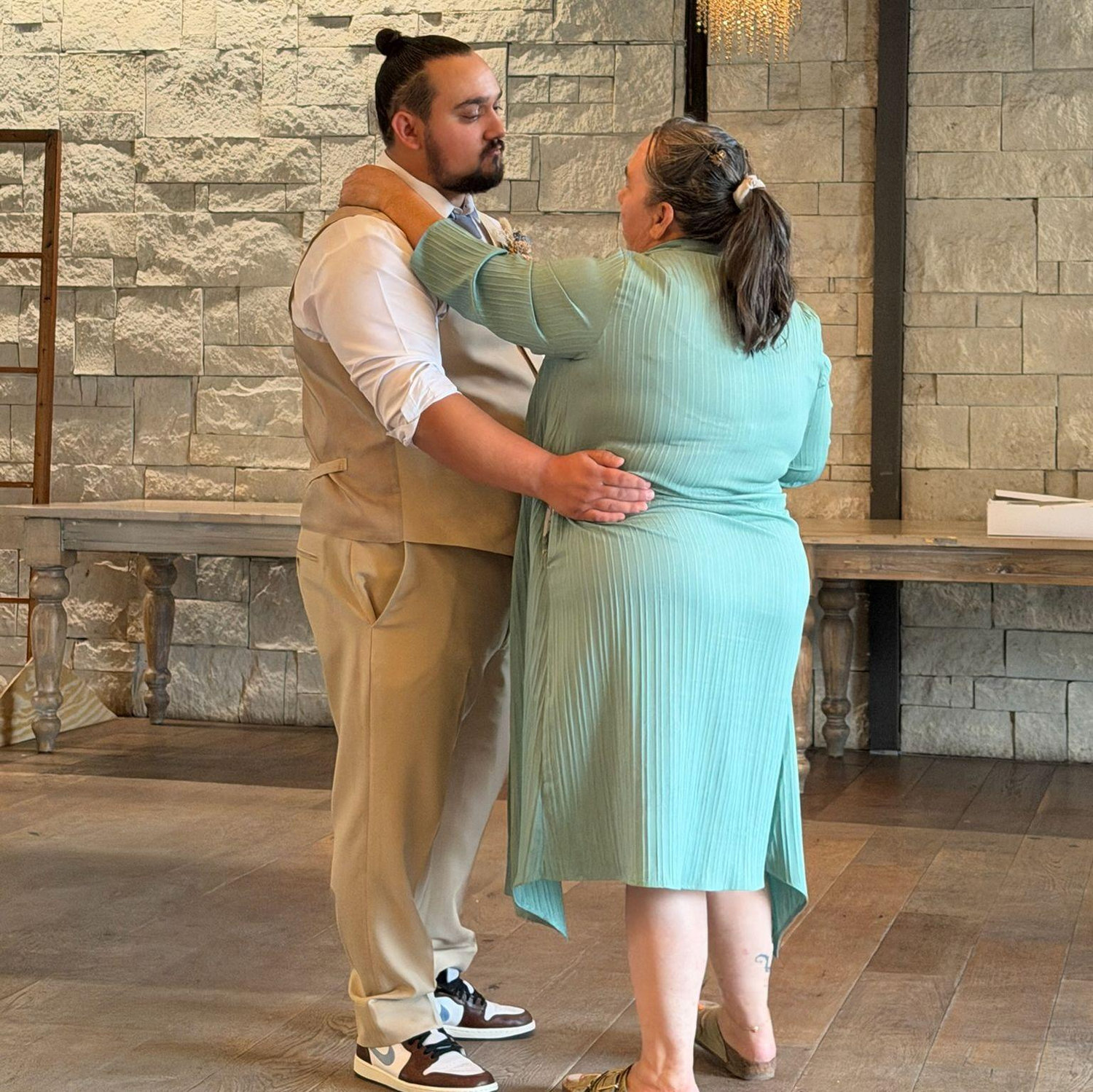 The groom and his mom share a sweet moment during their dance.