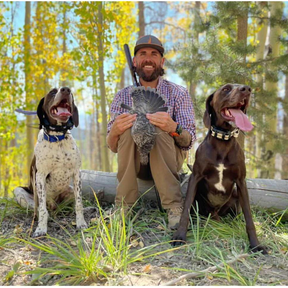 Tongues out! Fuego and Smoke with their Dad doing what the boys love best.