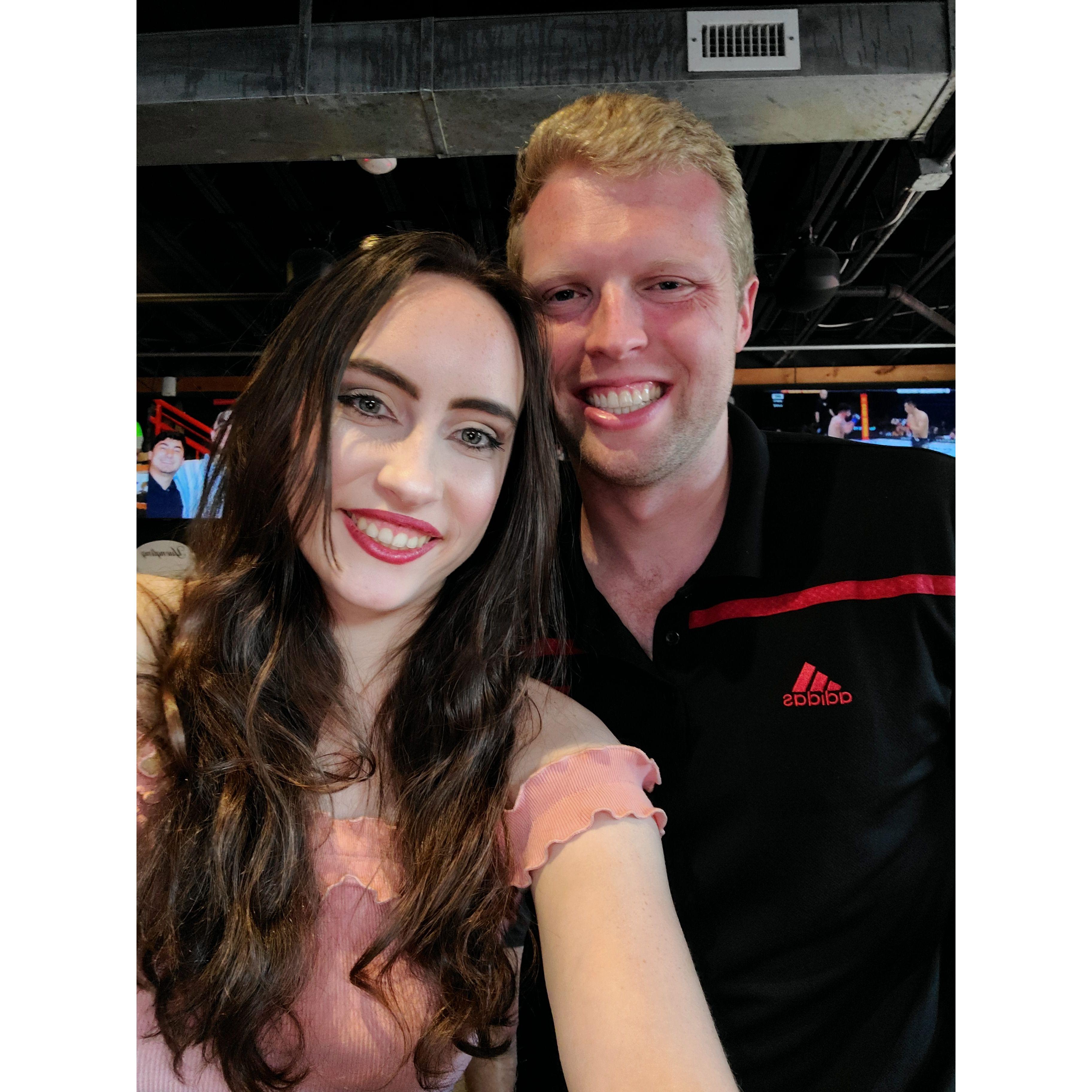 Anna and Riley pose for a photo at one of their favorite places, Kilroys on Kirkwood in Bloomington, IN, during summer of 2022.