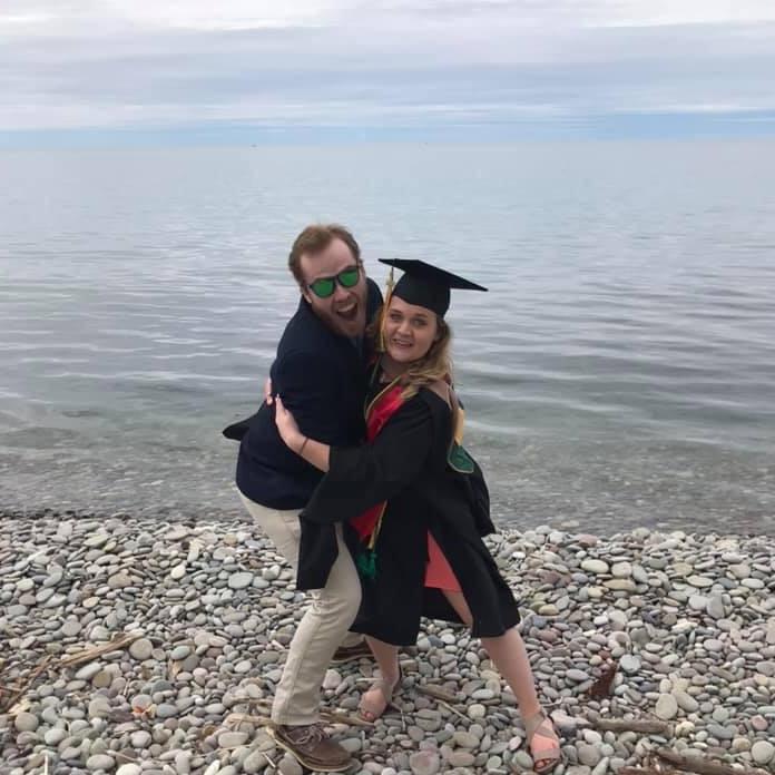 Kelsey graduating with her MBA. Not pictured: Kelsey forgetting everything she learned two seconds after this picture was taken.