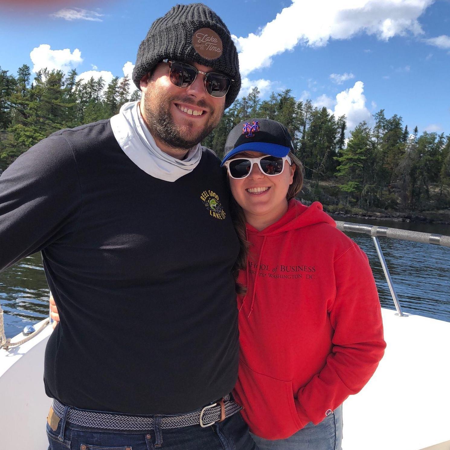 Our first vacation together - International Falls, MN (Sept 2021)
Alt Text: Maeghan and Keiran on a boat with Voyageurs National Park and Forest in the background