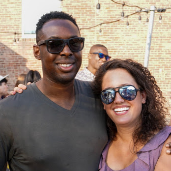 Queso smiles on Felipe's rooftop in Cambridge, Massachusetts, for Temi's 30th birthday.