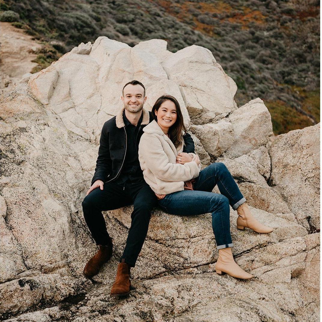Sitting on a cool looking white Rock in Big Sur right after we got engaged.