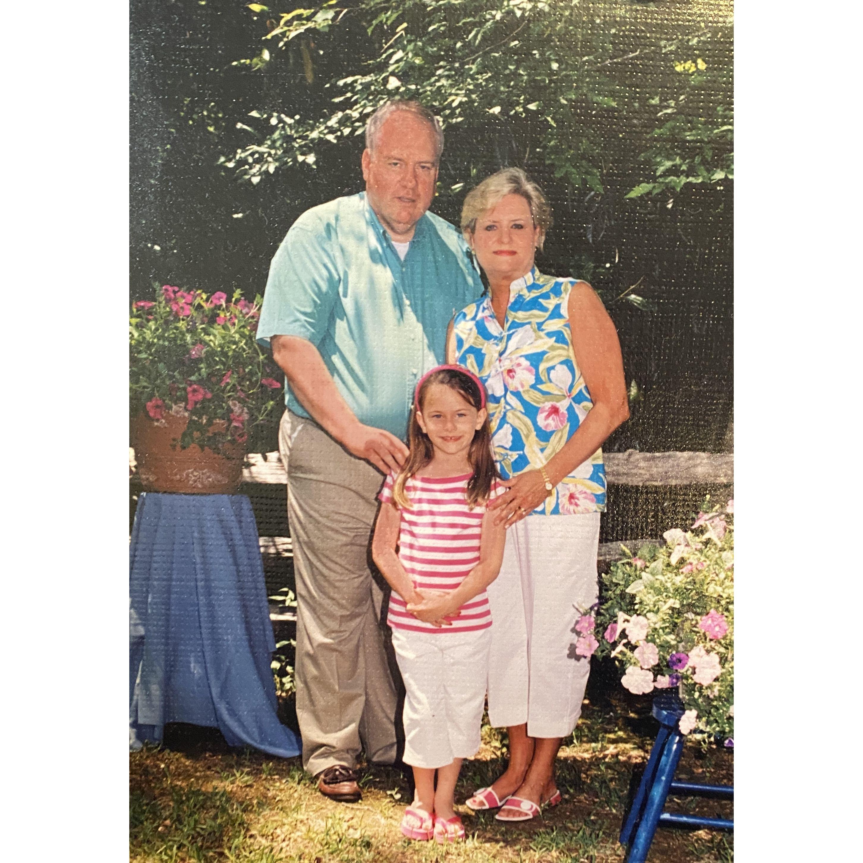 Sarah and her parents when she was five.
