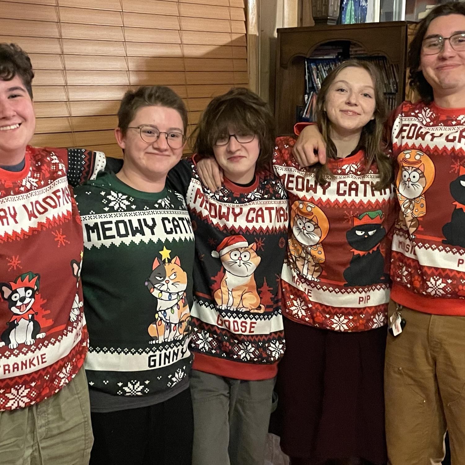 Zoie's mom got us Christmas sweaters with all of our respective pets on them!