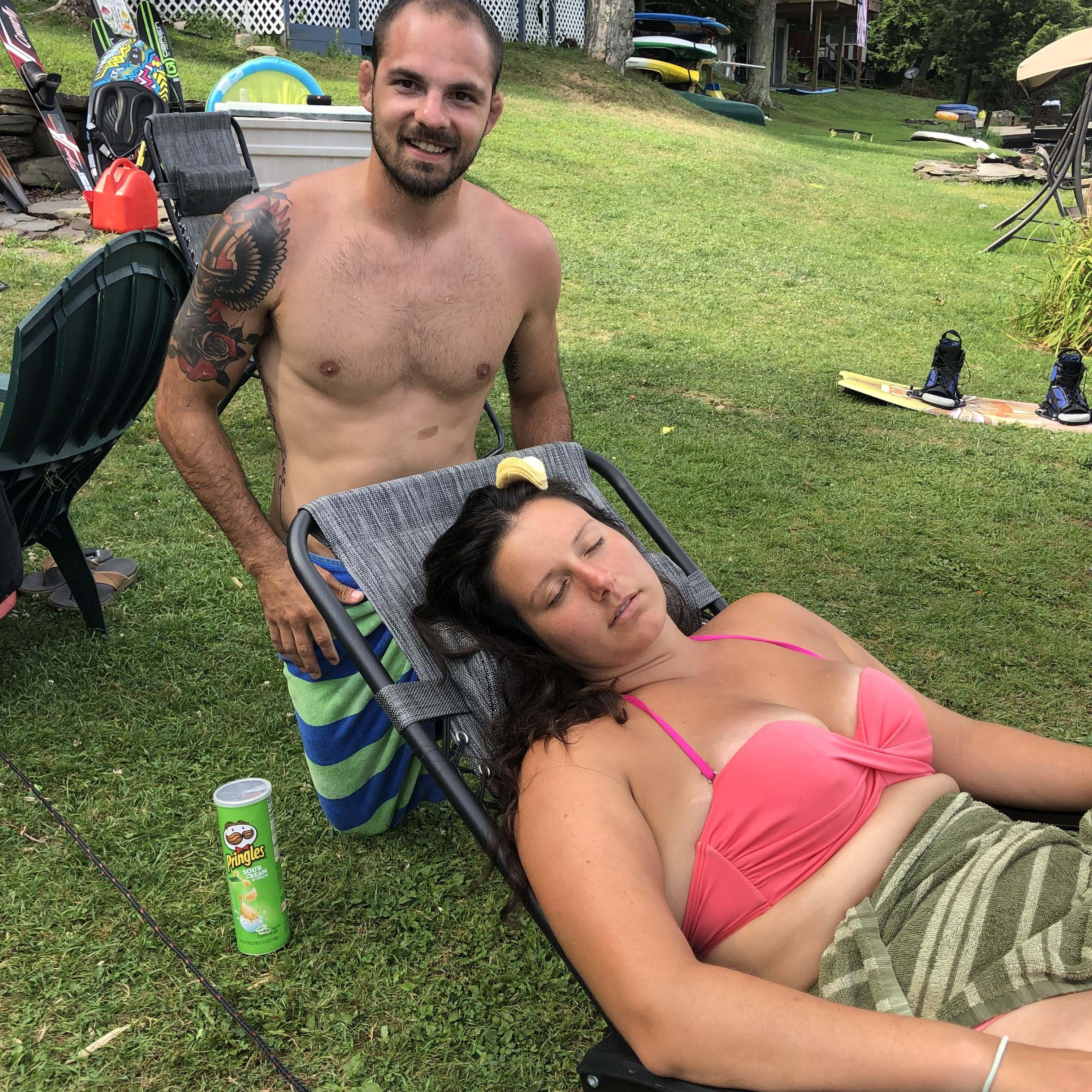 Kat getting "crackered" (When you fall asleep at the lake and someone stacks crackers on you) by Joe's Brother, Tony. This was a frequent occurrence.