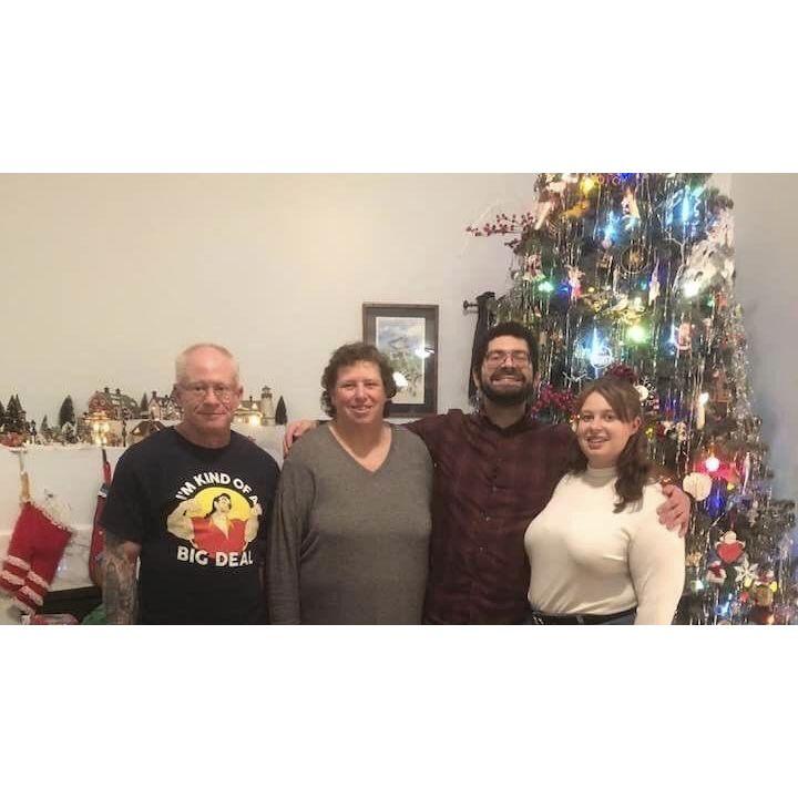 Us with Katie's parents the night we got engaged (Christmas 2021)