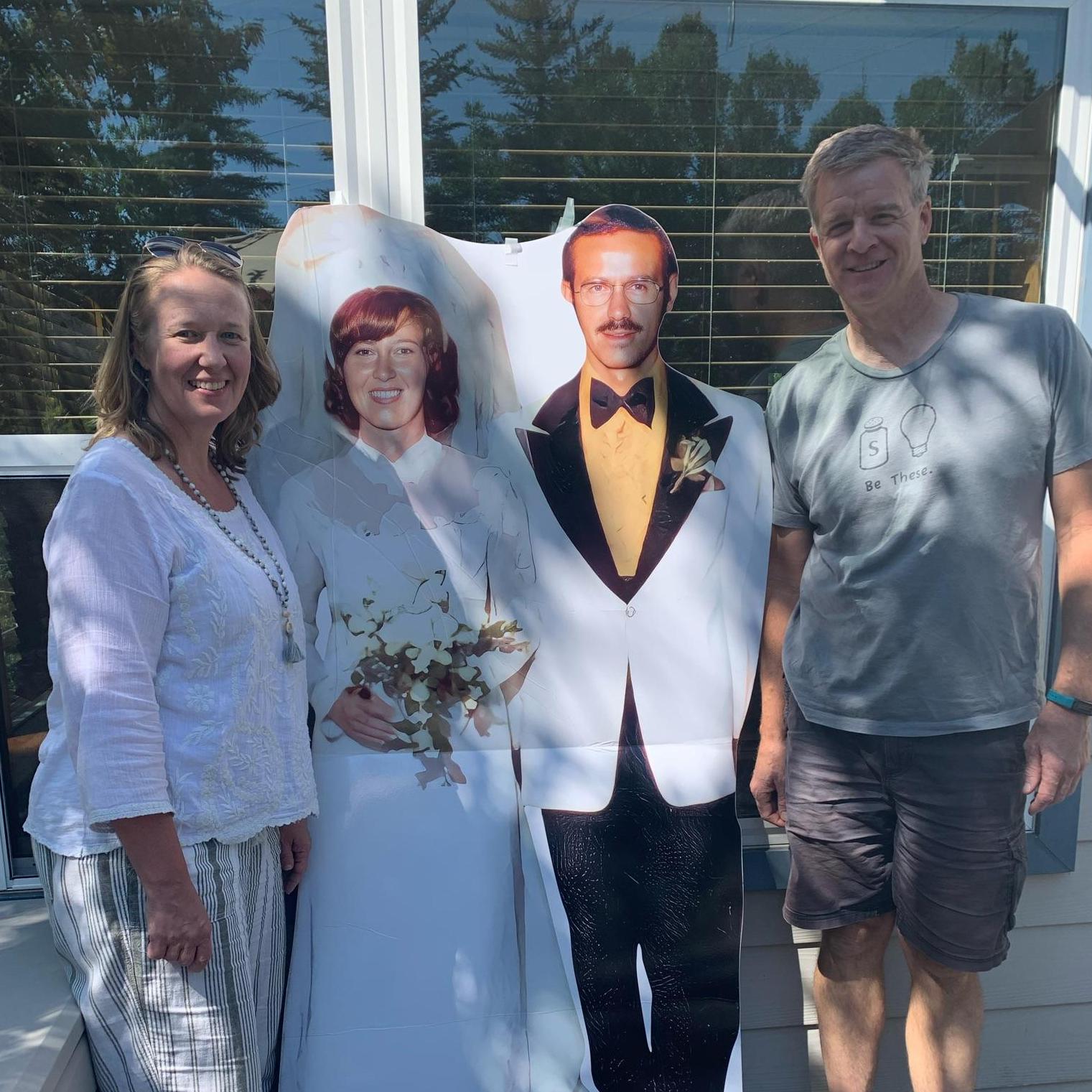 Posing with Dave and Barb's 50th Wedding Picture.