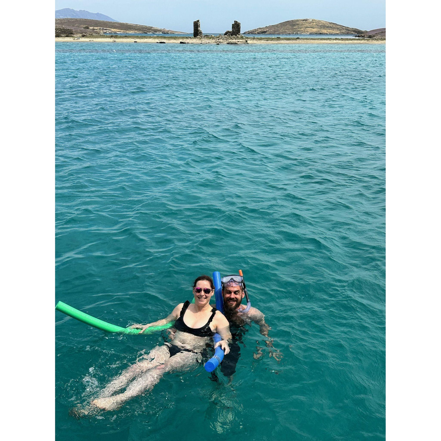 Freezing our assess off to say we got in the water at Rhenia island in Greece
