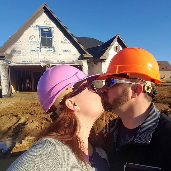 A kiss while on a site visit to our Memphis home while it was under construction.