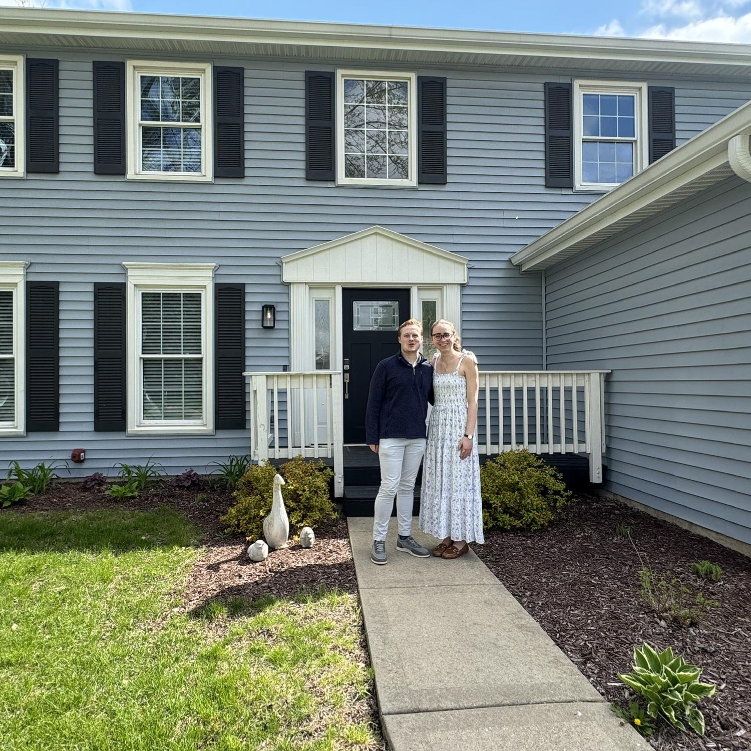 Kristen and Sean outside their new house on closing day!