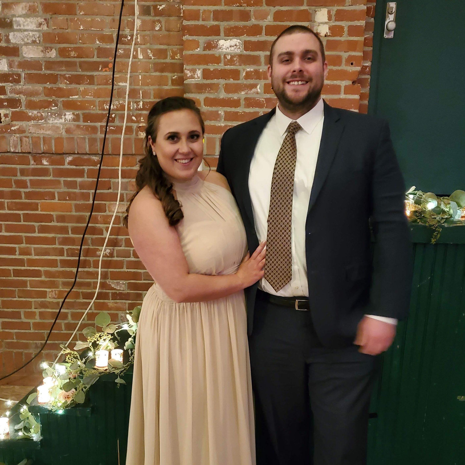 Maeghan is the MOH at Red's wedding in this photo - now Red is the MOH in ours!
Alt Text: Maeghan and Keiran all dressed up at Red and Matt's wedding in NC