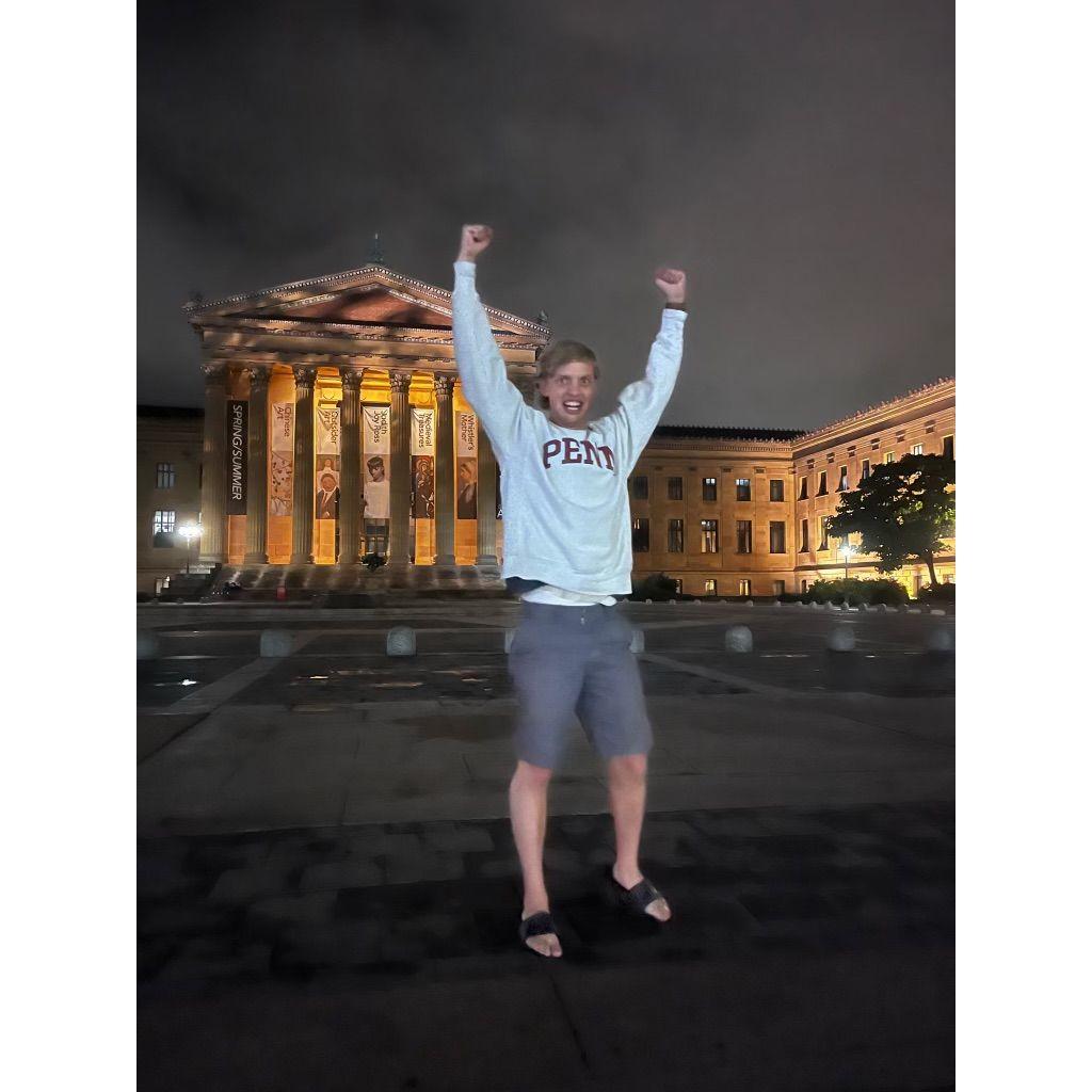 James poses in front of Rocky Steps (yes we played the theme song).