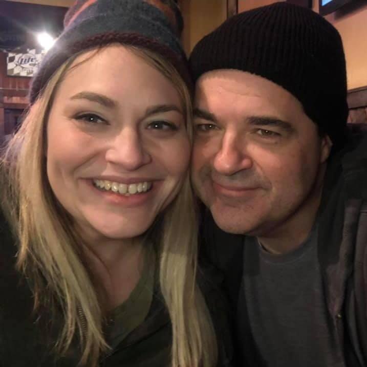 Eric thinks Erin looks cute in his hats.