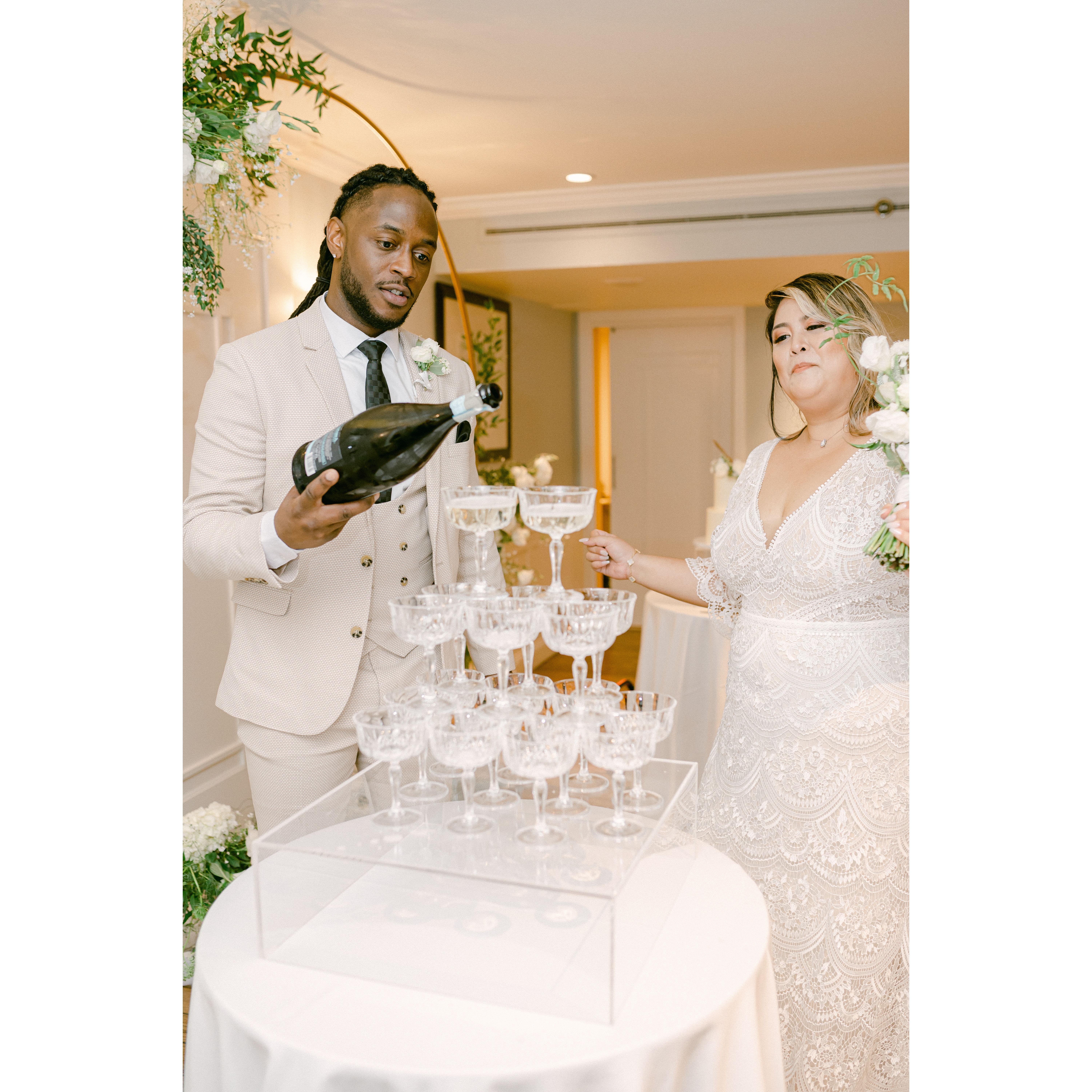 Aprille had been saying that if she had a big wedding, she would definitely have a champagne tower. Little did she know her cousin and sister had this surprise for her all along!
