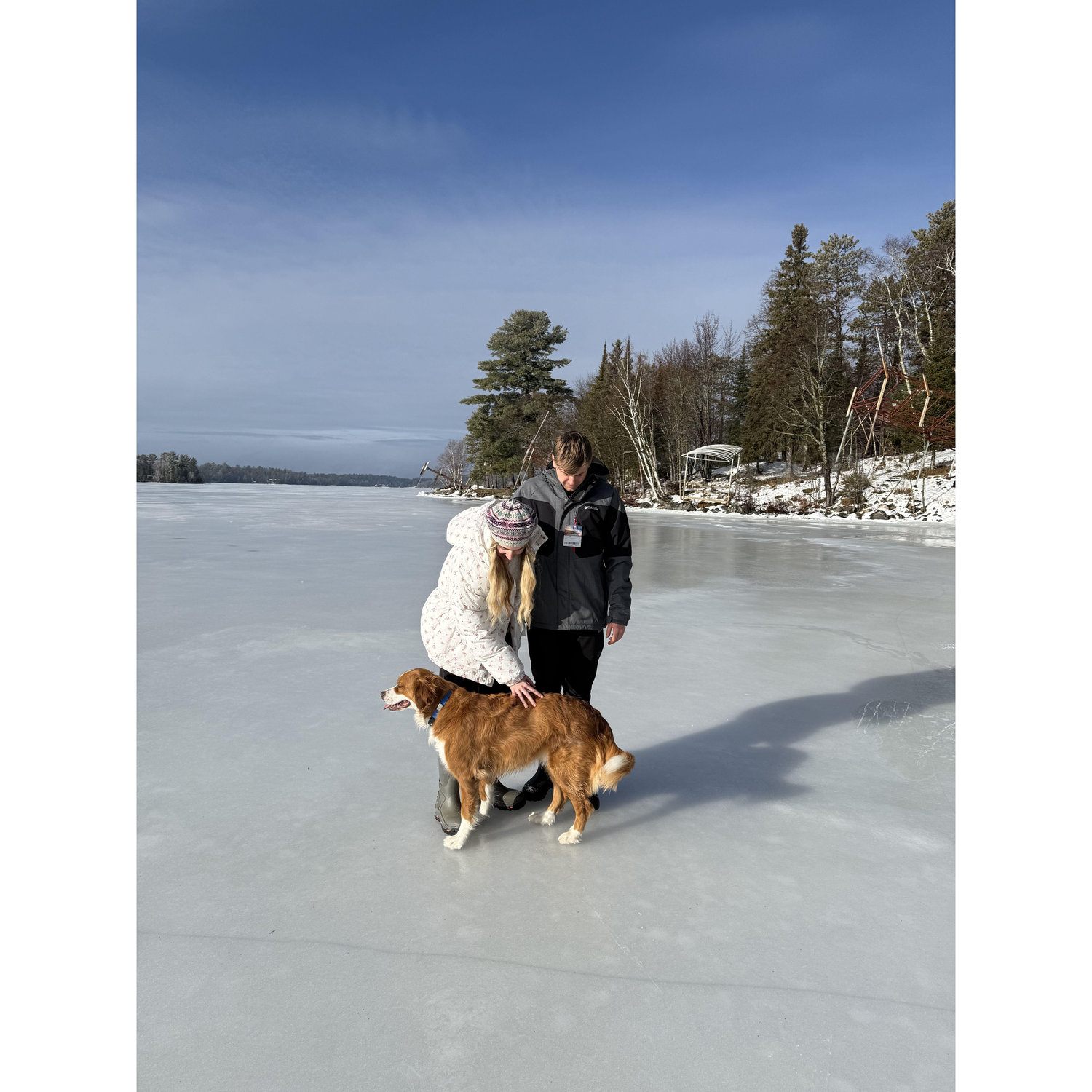 Walking on a frozen Lake Vermilion with our doggy niece Maggie