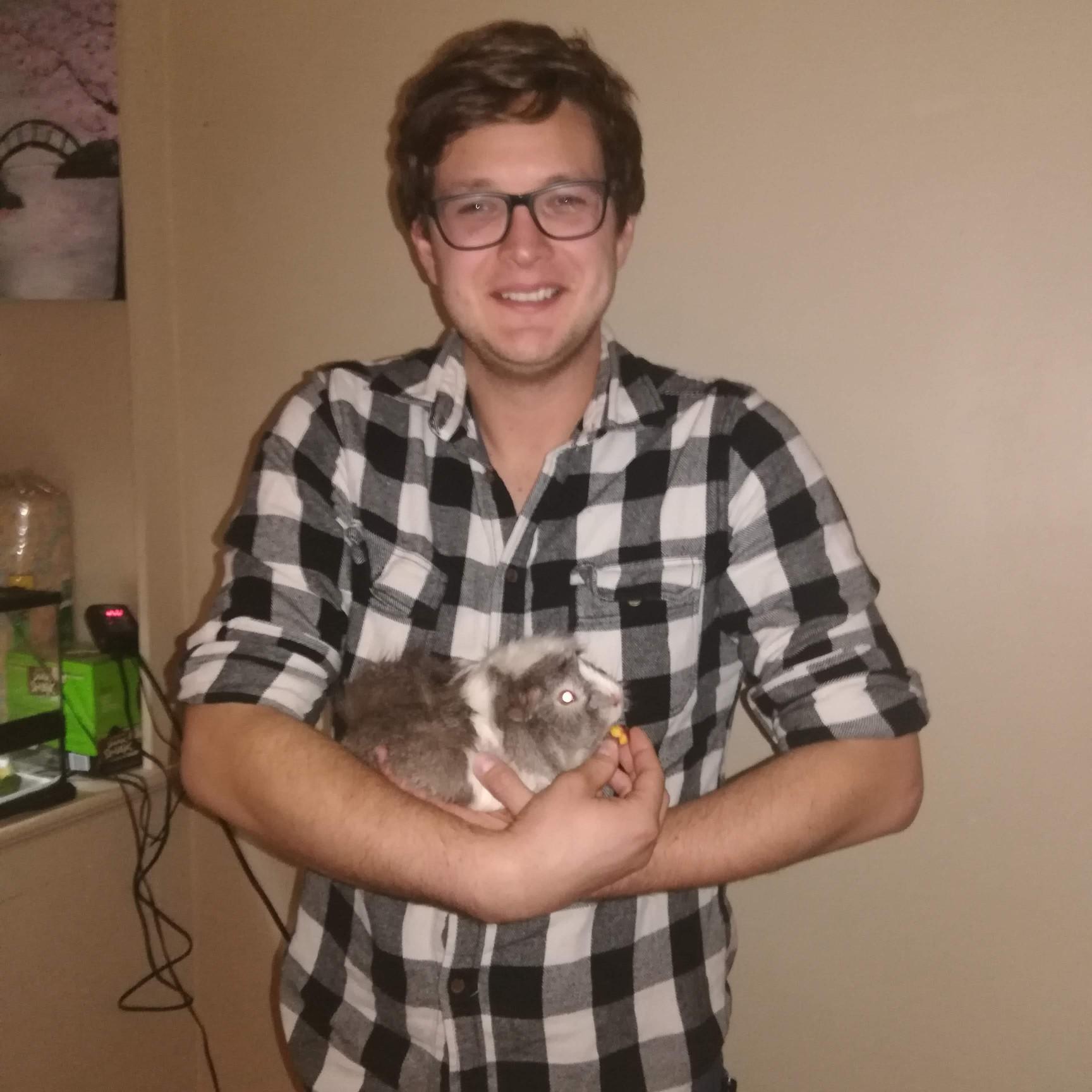 Ryan and Pepper, the guinea pig - Kittery, ME - August 2018