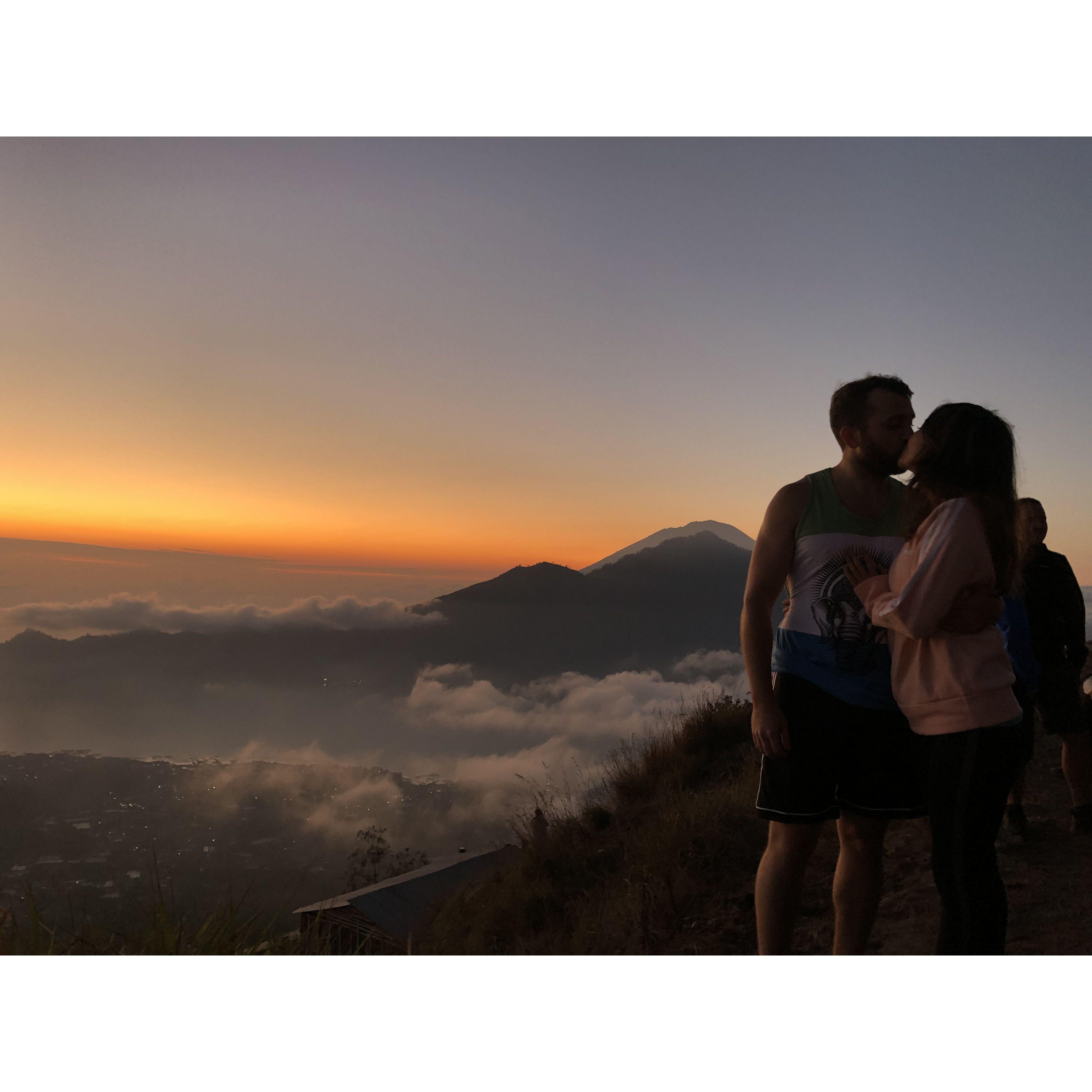 Sep 2019 - A congratulatory kiss, while watching the break of dawn atop Mount Batur in Bali, Indonesia. We just completed a 2.5 hour hike to the summit at 5,633 ft.