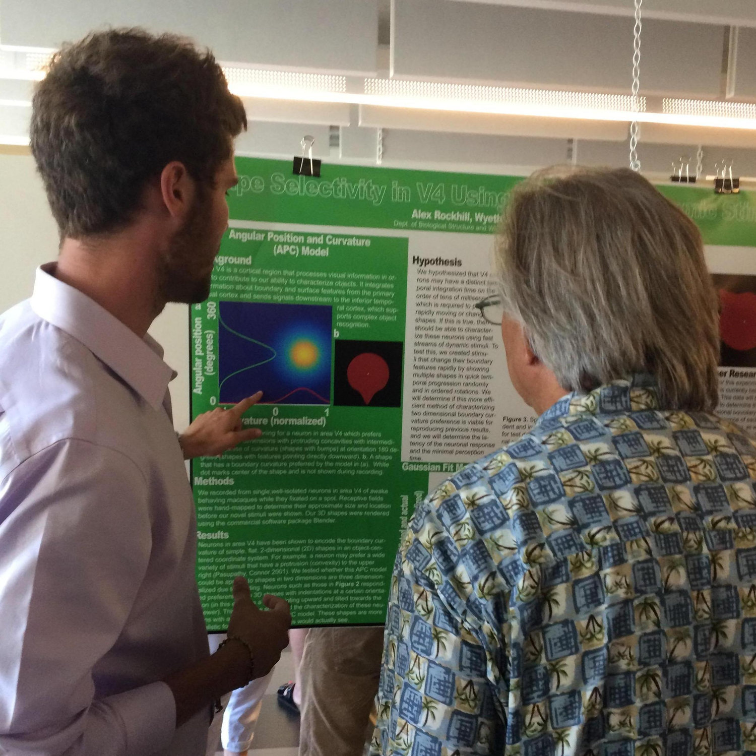 Alex presenting his Neurobiology research at the University of Washington, Pearl cheering on from behind the lens!