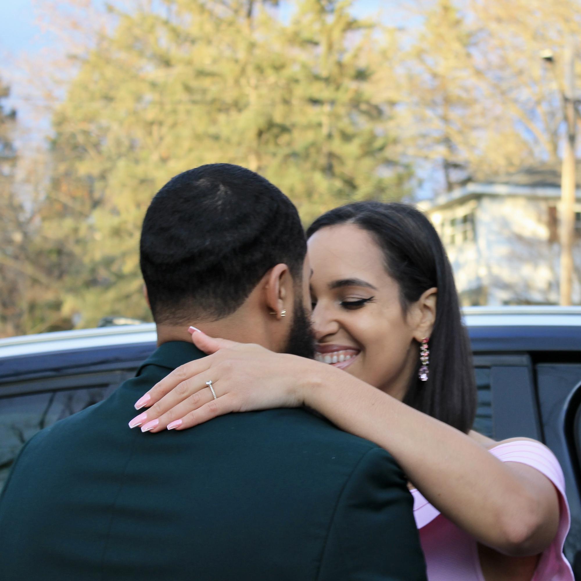 A celebratory embrace.