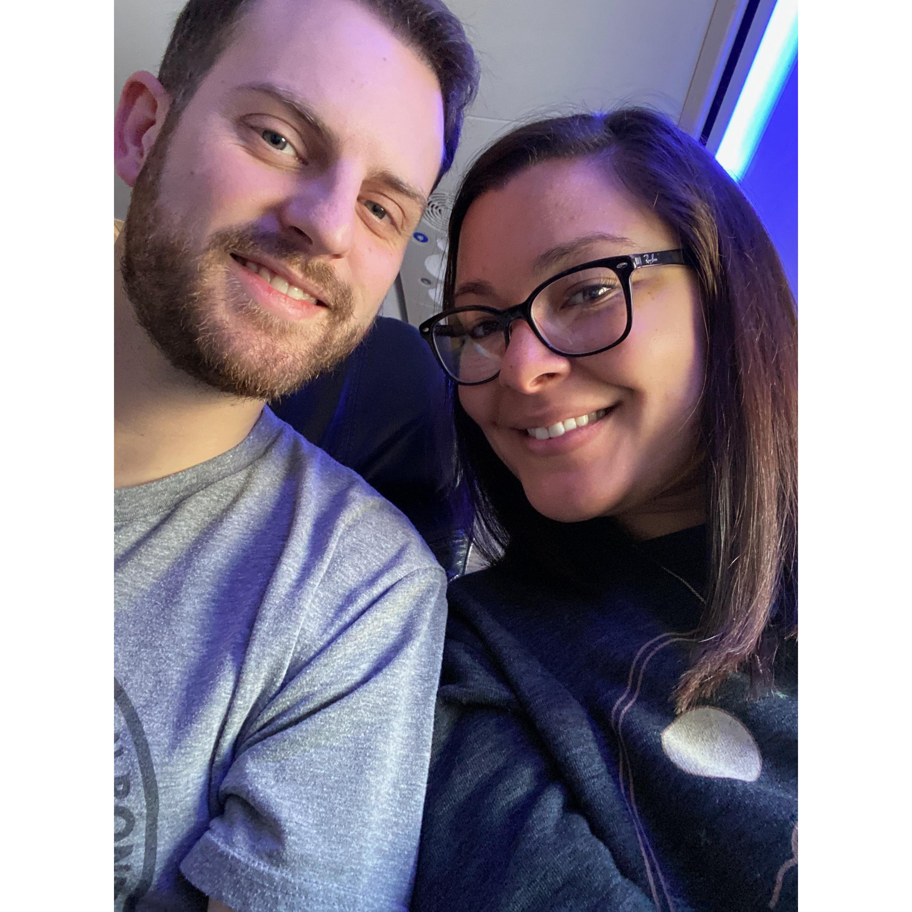 on the plane to our first big trip together in Hawaii