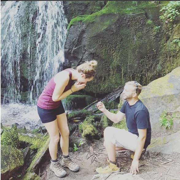 After a very long, hard, hot hike.....he popped the question!  A family was at the waterfall having a snack and was able to capture this photo!