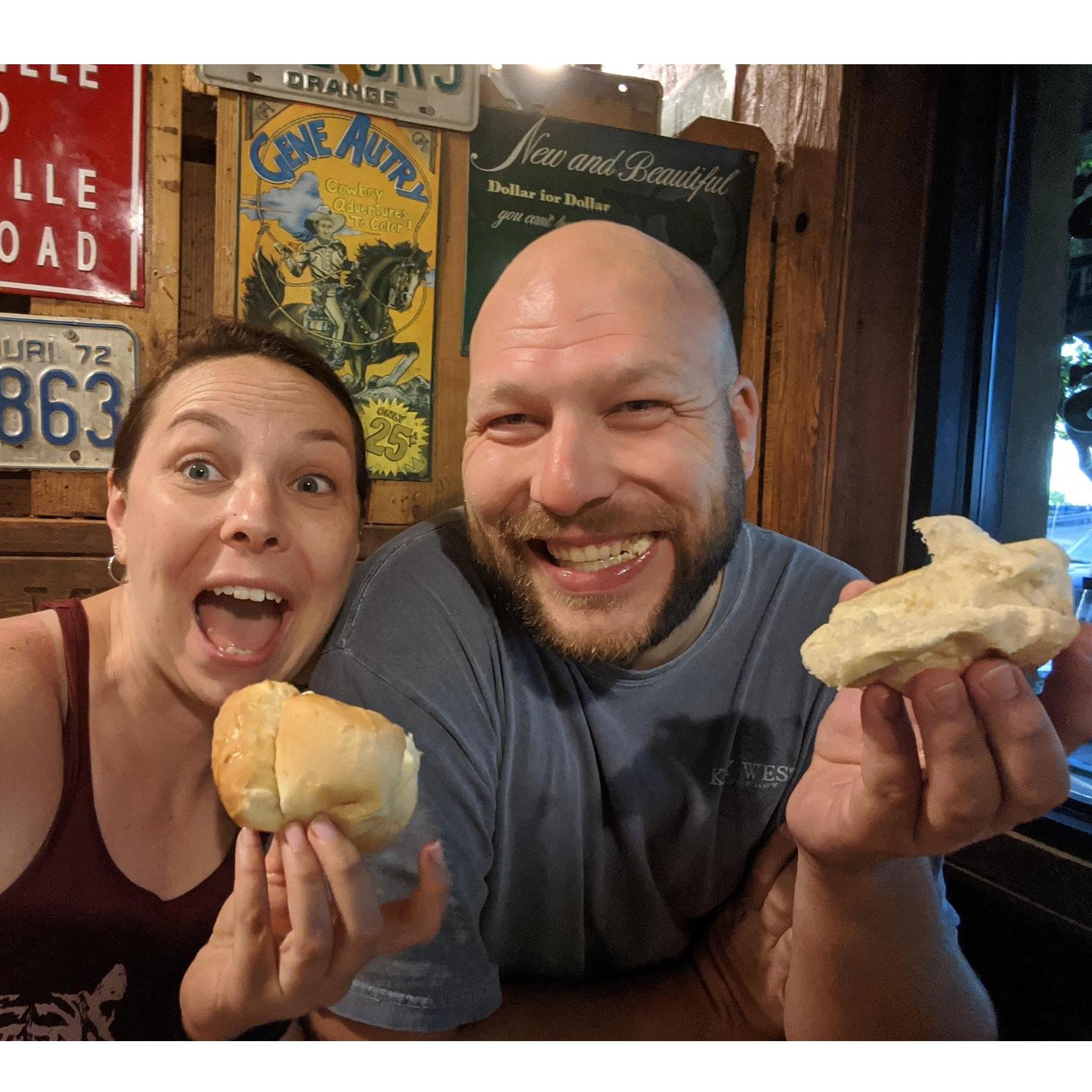 Celebrating having caught their "thrown rolls" at Lambert's restaurant in Springfield, MO.