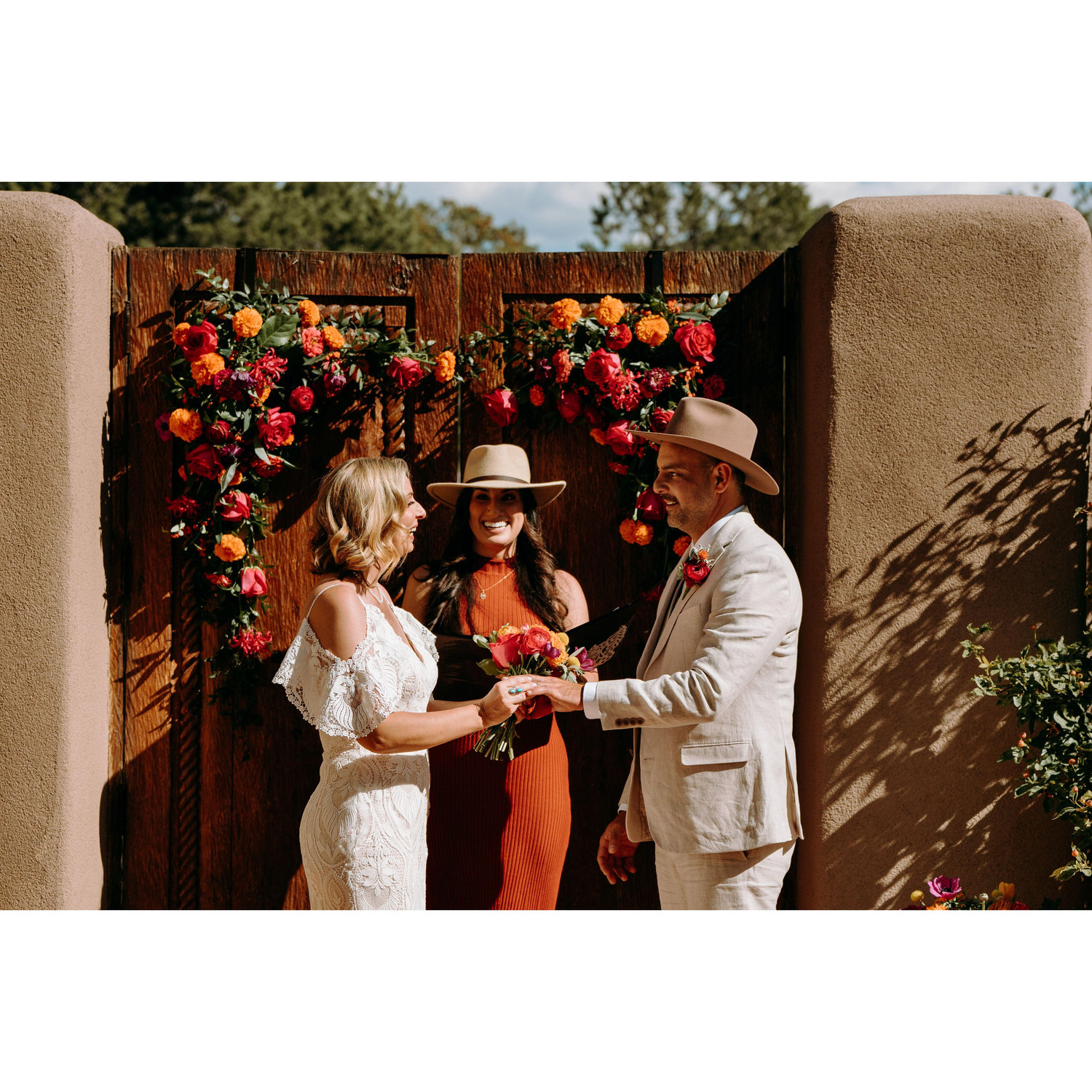 Vow ceremony - Jenn and Shae hold hands as Marie continues the ceremony