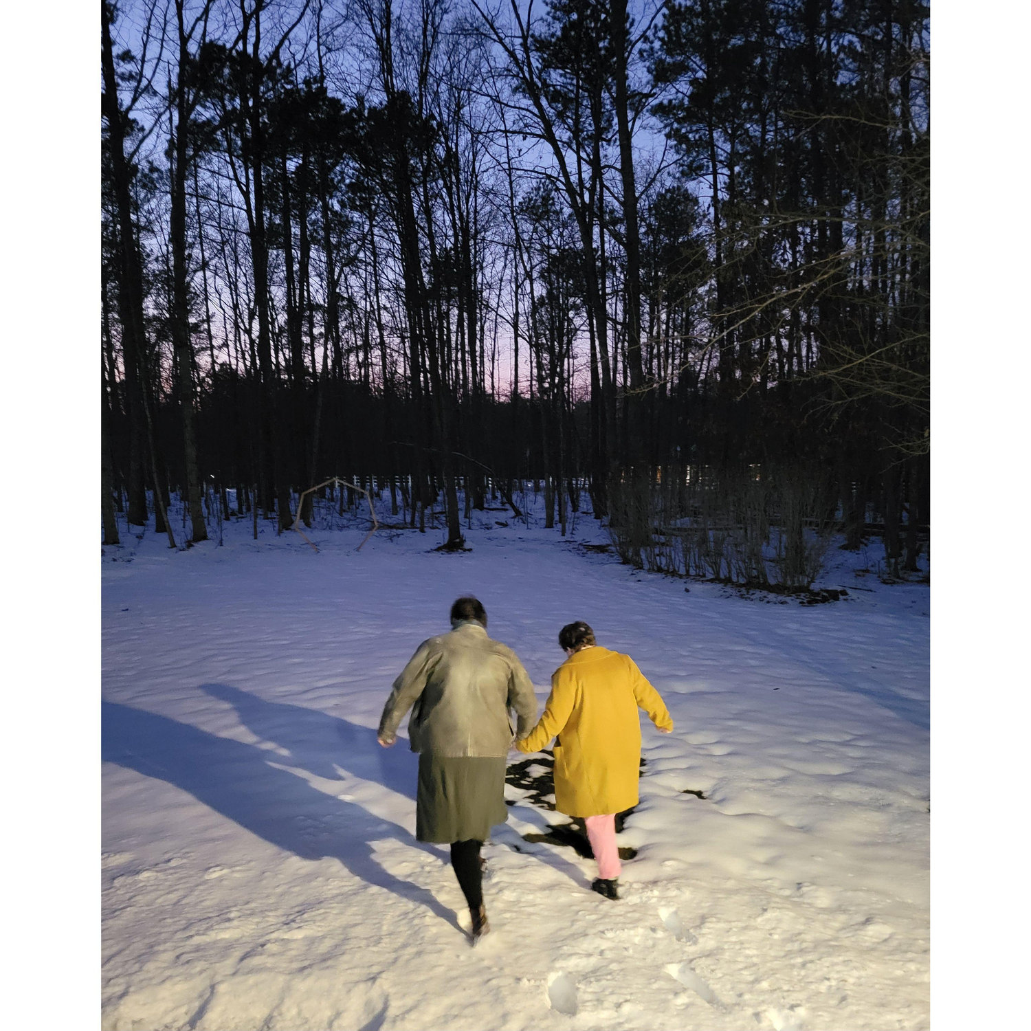 Mary Jane and Austin walking to get (legally) married in the snow