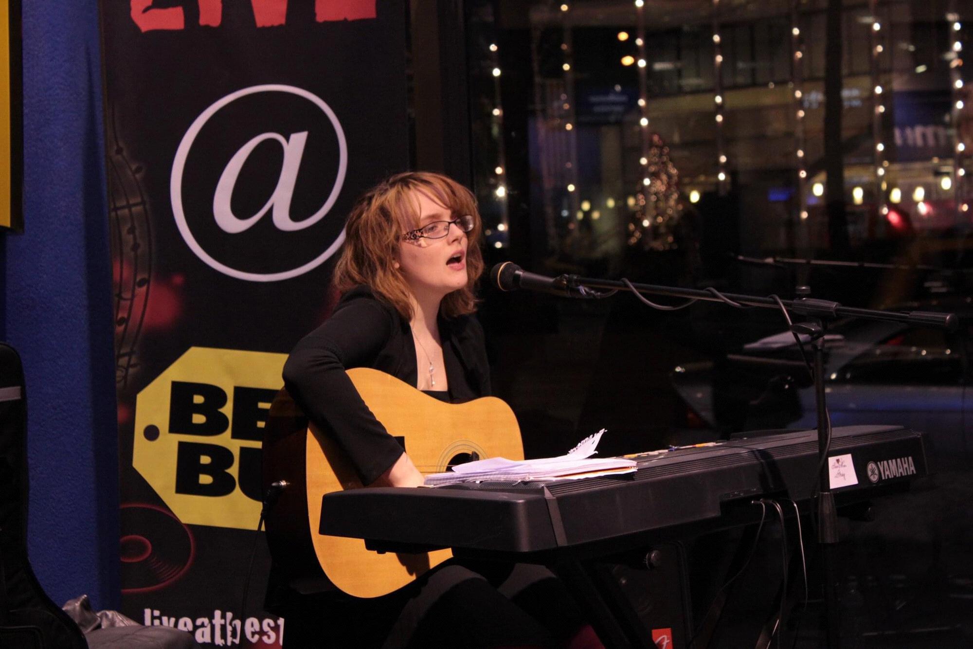 Julia performing at the Best Buy Live series on Chelsea Market and playing her songs for a captive audience.