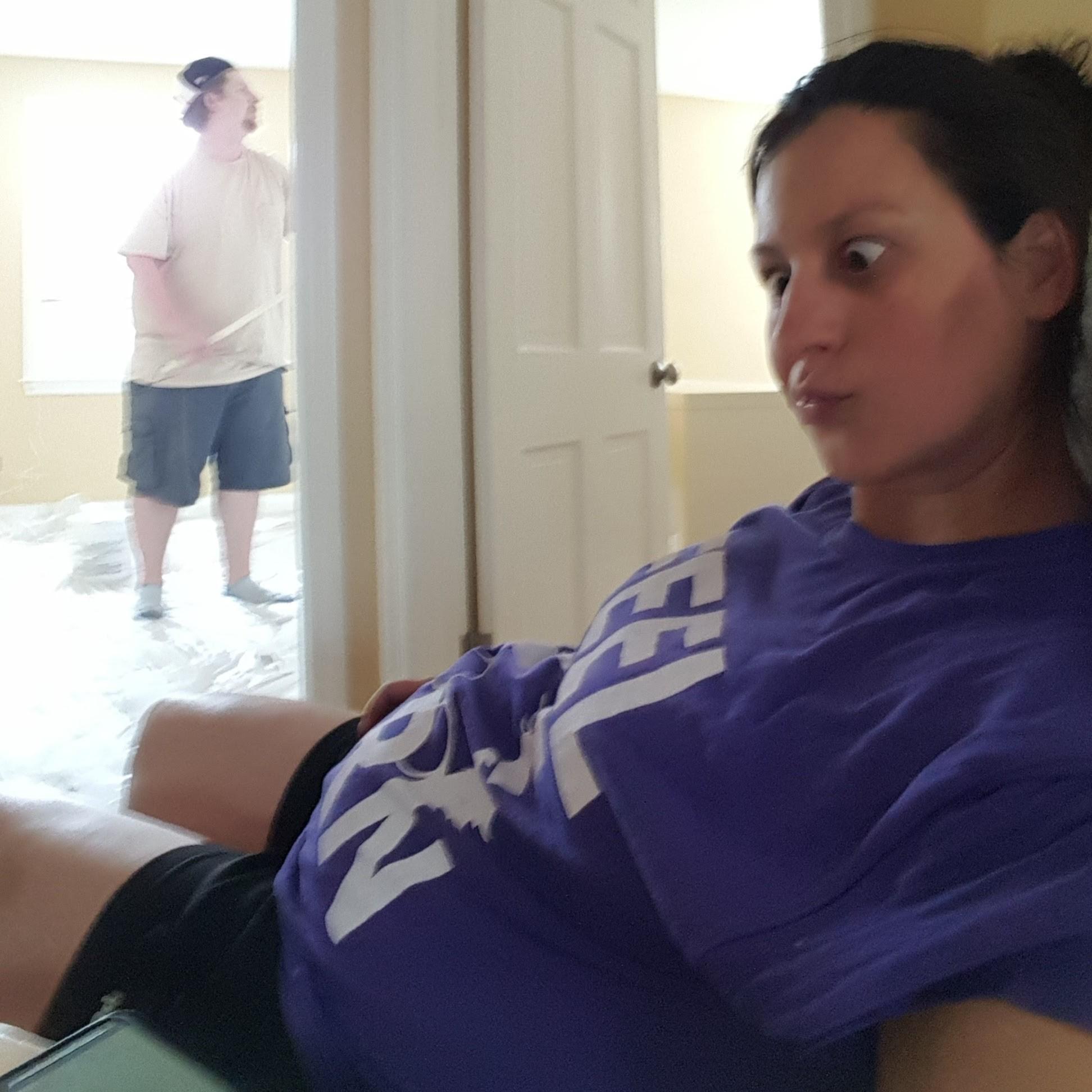 Surprisingly, there are few photos of us together while pregnant. This was the only one that had both of us and the baby belly! LOL! Nick had to take over painting the nursery.