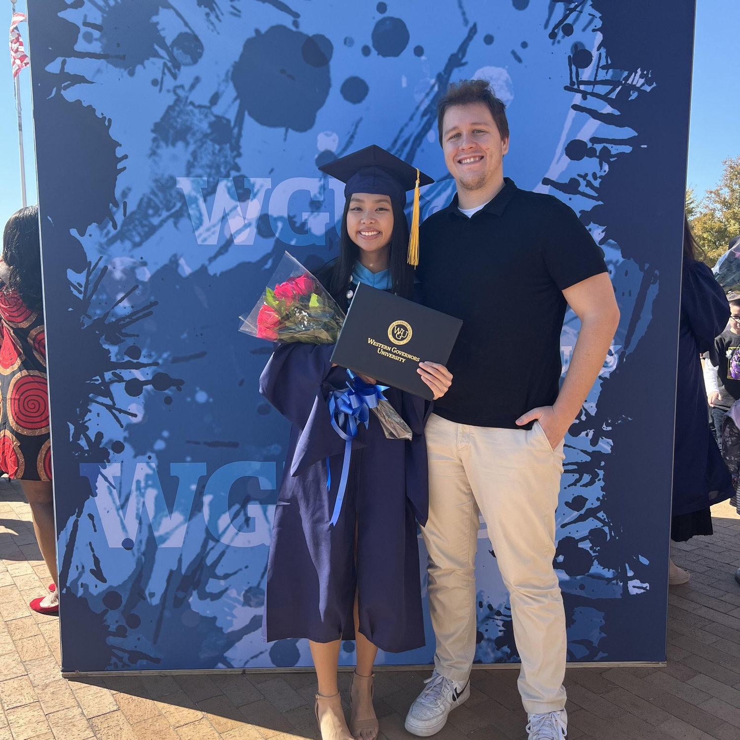 Korbin supporting Danielle at her master’s graduation