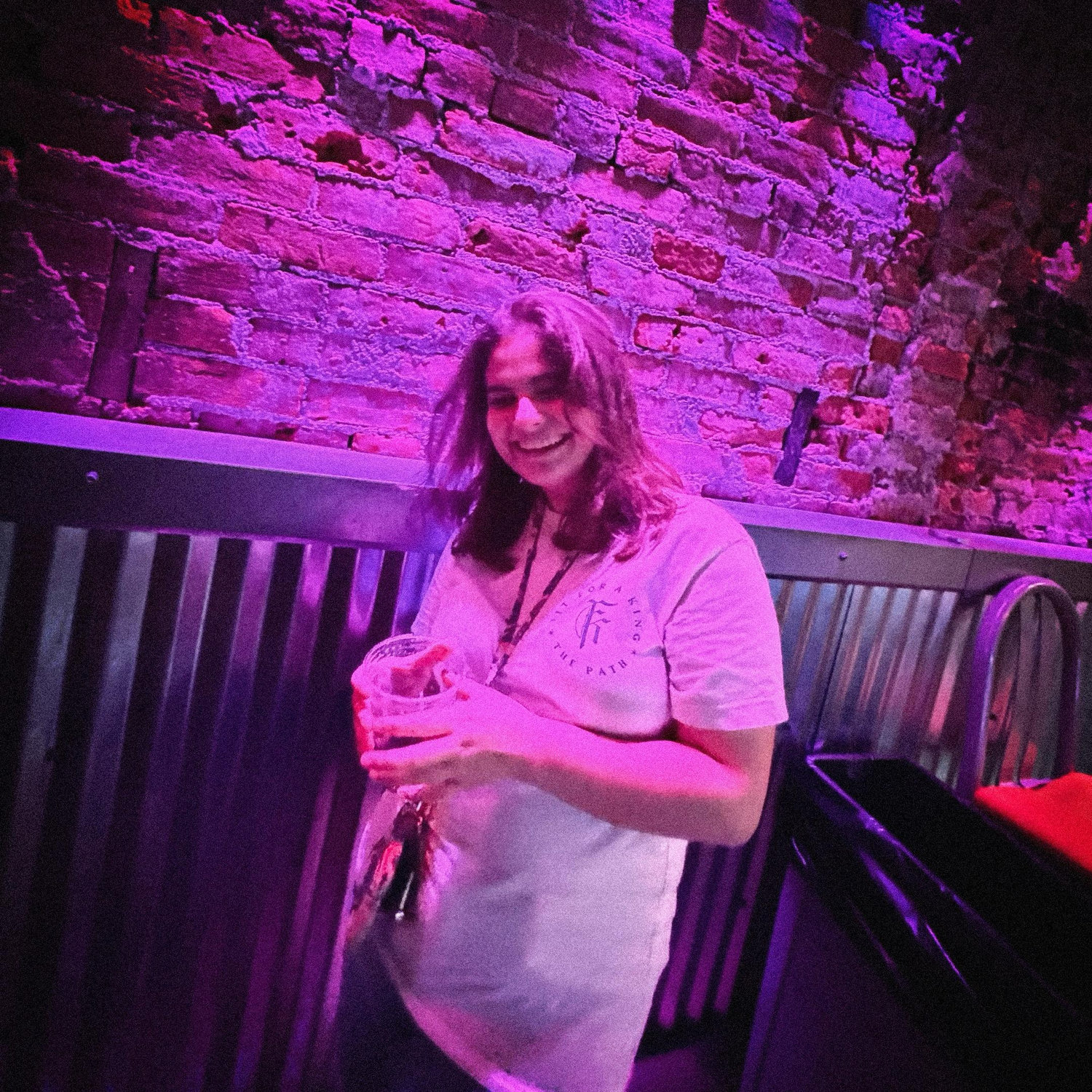 Photo of Shannon laughing at Sam's dad jokes at Sam's gig at Madison Theater in Covington, KY on 8/8/24.